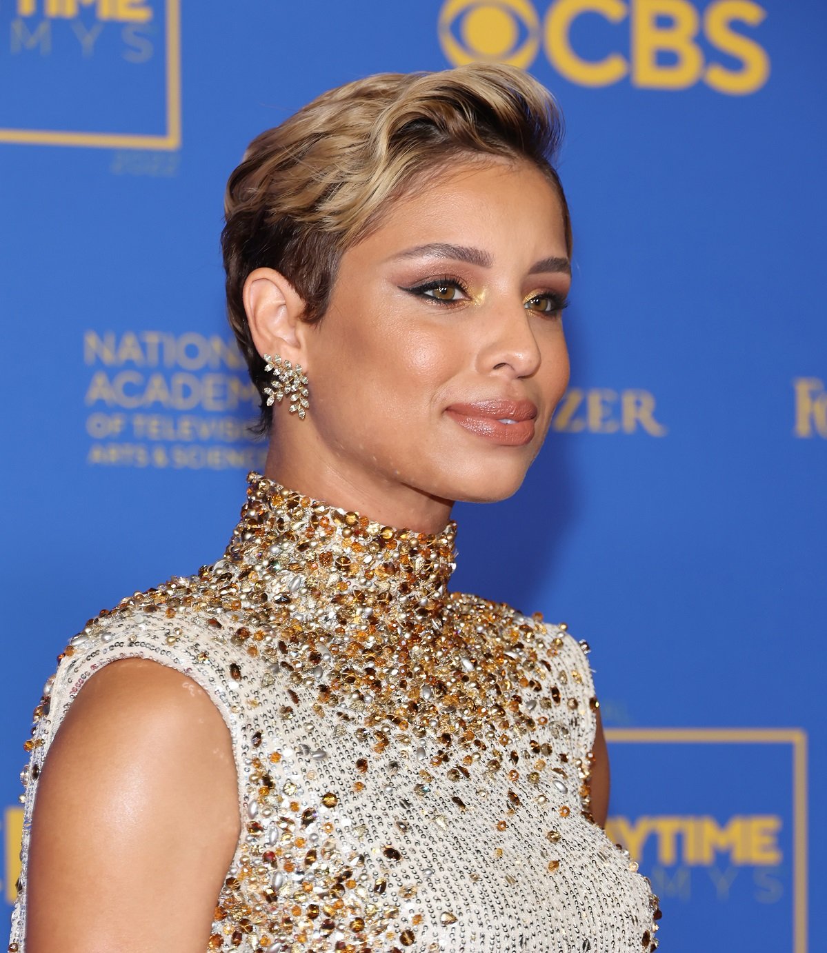 'The Young and the Restless' star Brytni Sarpy in a white and gold sparkly dress during the 2022 Daytime Emmys.