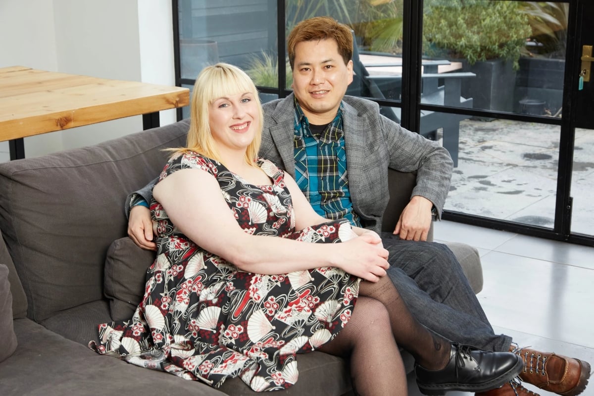 Victoria and Sean sit together on a couch for promo photos for '90 Day Fiancé UK' Season 1.