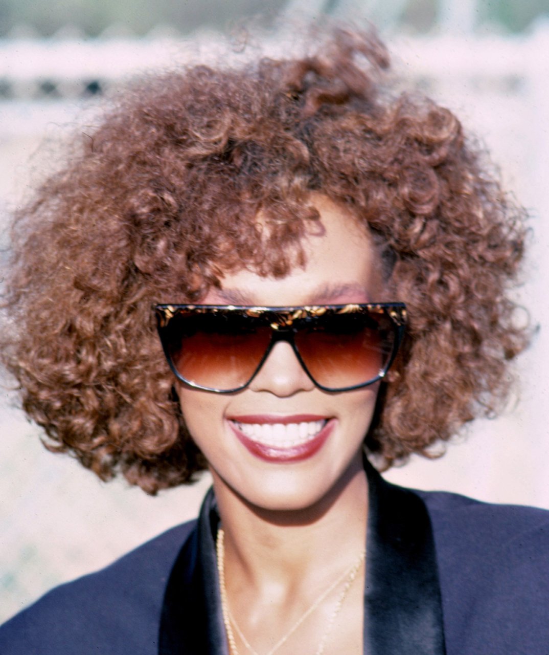 Whitney Houston smiles for camera; Houston's estate released a new fragrance line via HSN