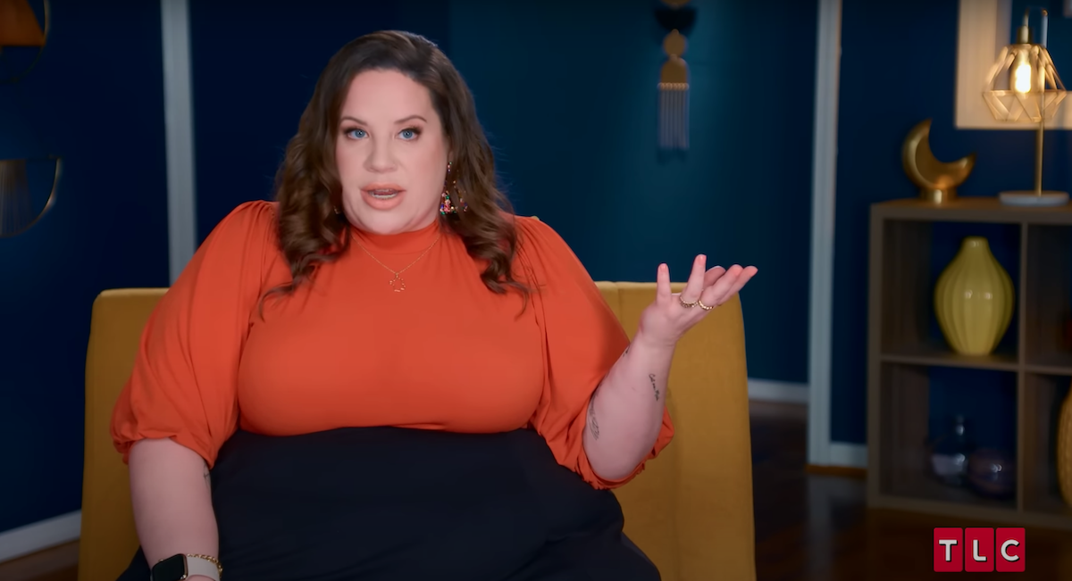 Whitney Way Thore in an orange top in an episode of 'My Big Fat Fabulous Life'