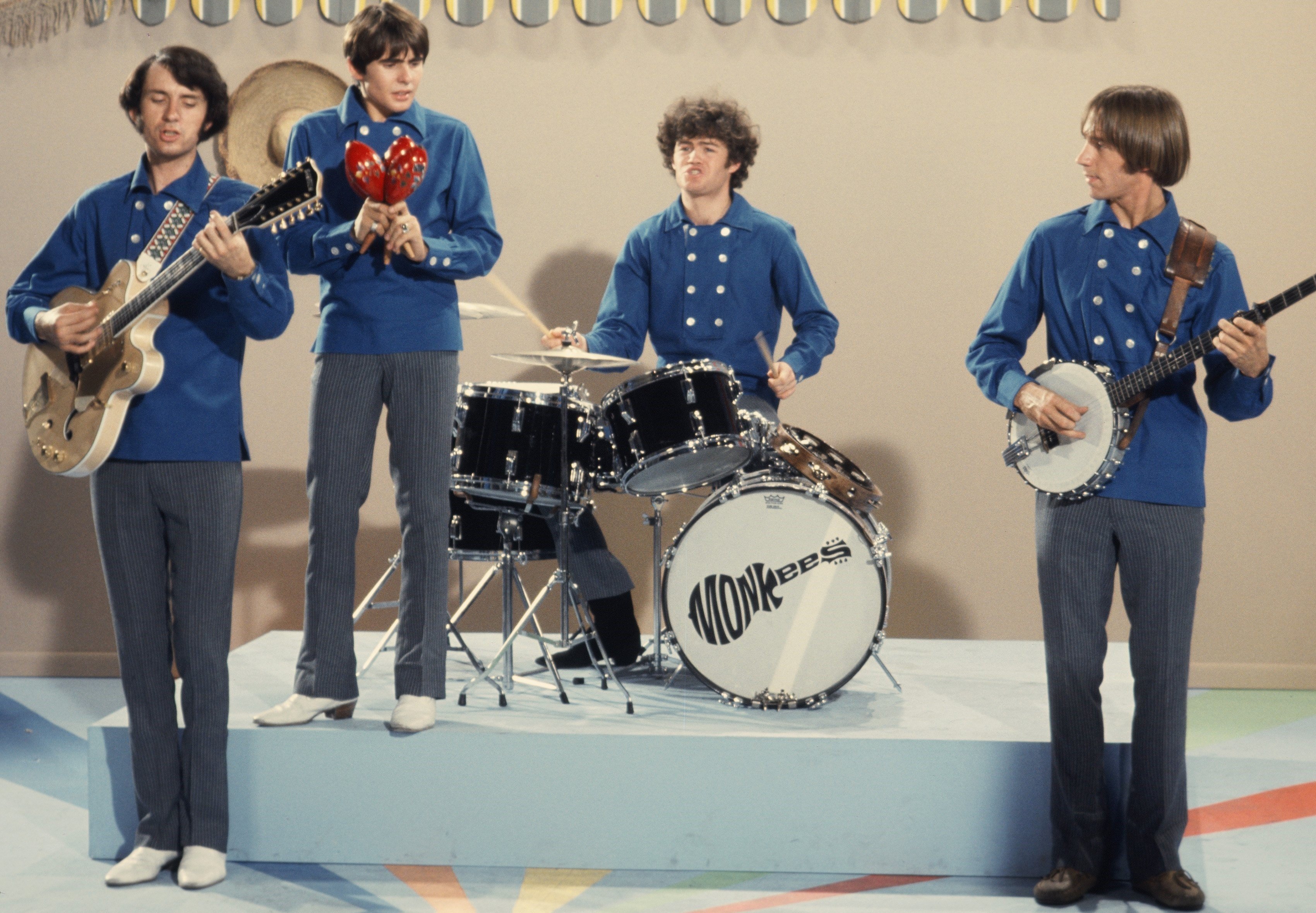 The Monkees’ Mike Nesmith, Davy Jones, Micky Dolenz, and Peter Tork playing instruments