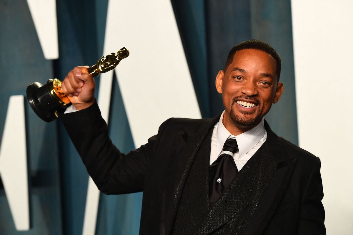 'Emancipation' star Will Smith holds up his Oscar after the ceremony