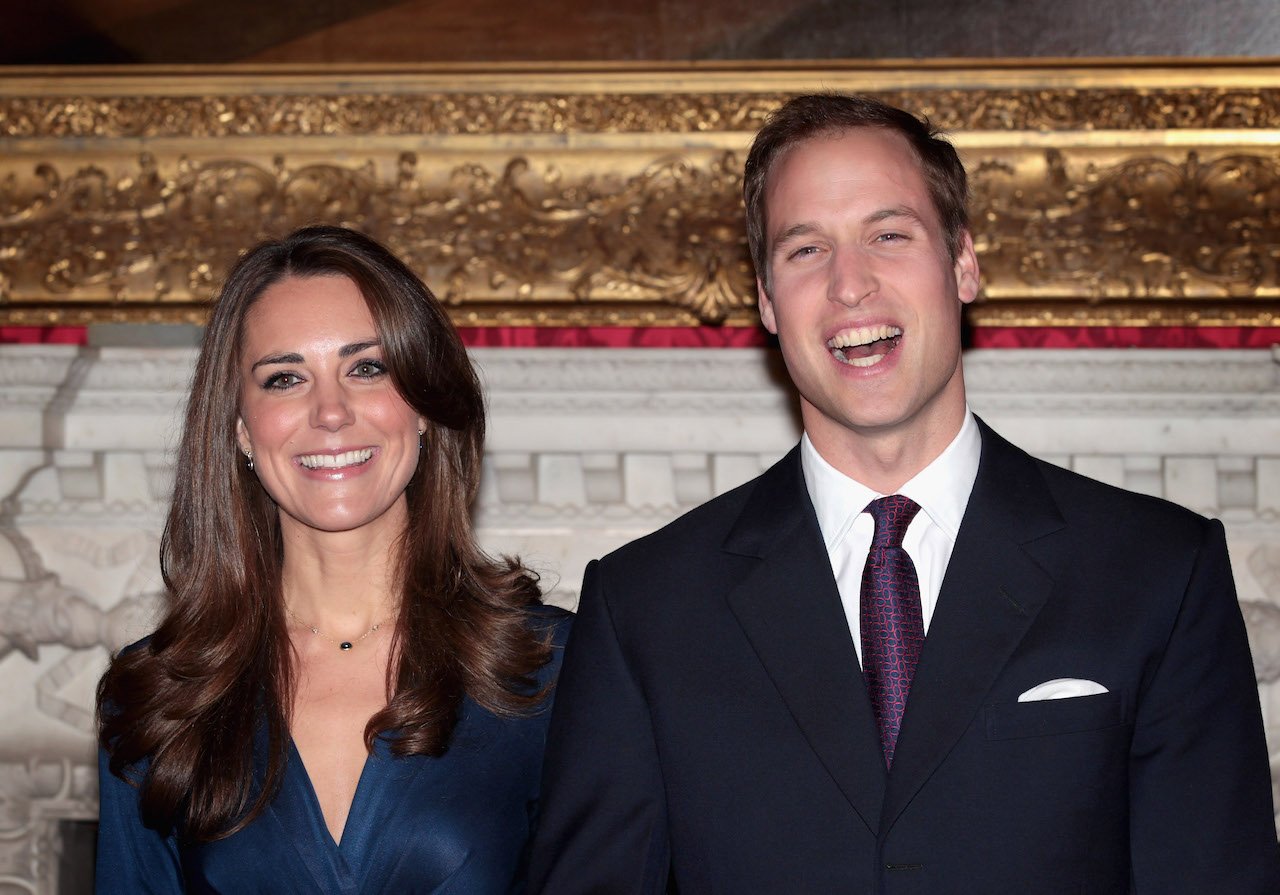 Prince William and Kate Middleton pose for photographs after announcing their engagement.