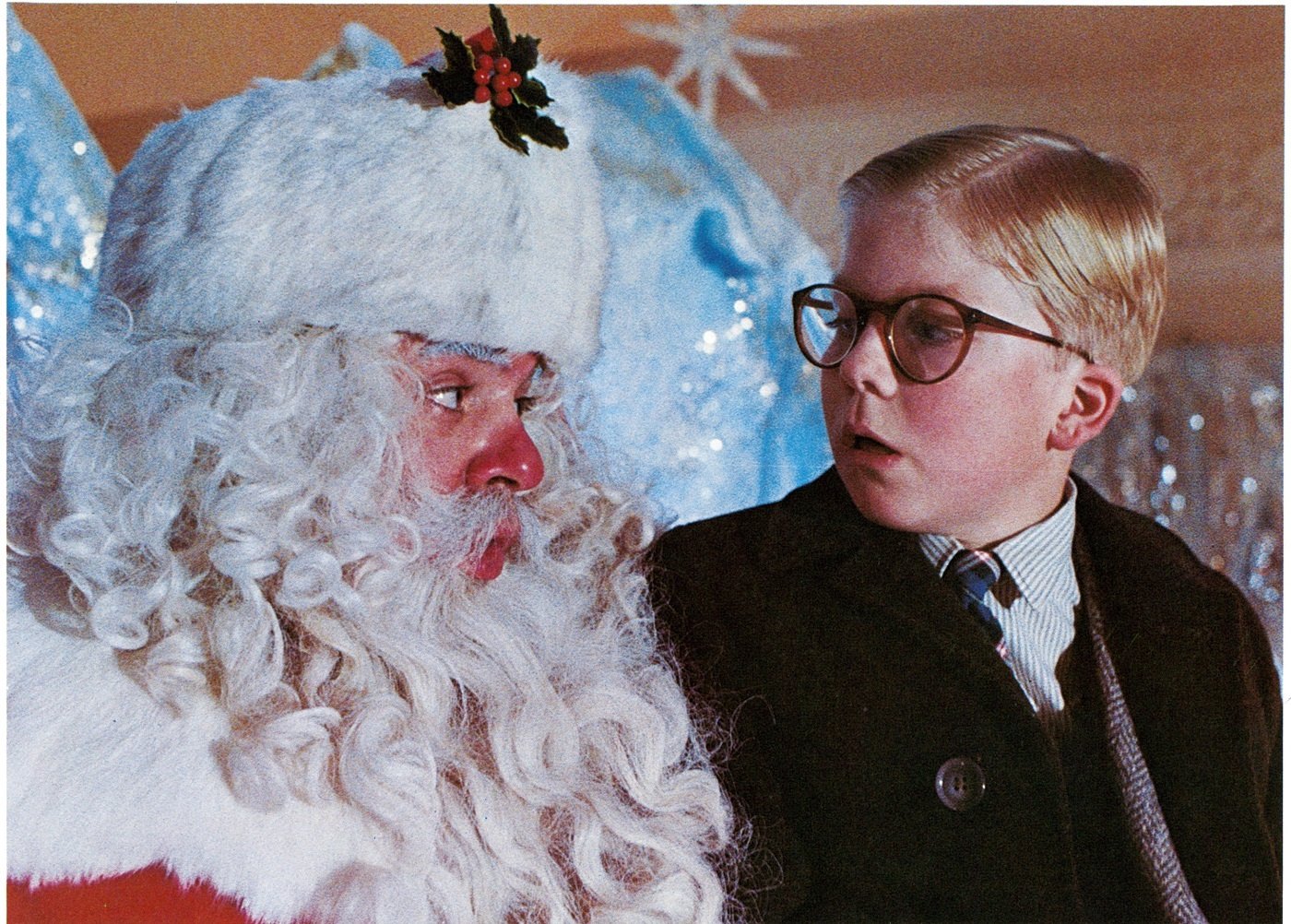 Peter Billingsley sits on Santa's lap in a scene from the film 'A Christmas Story',