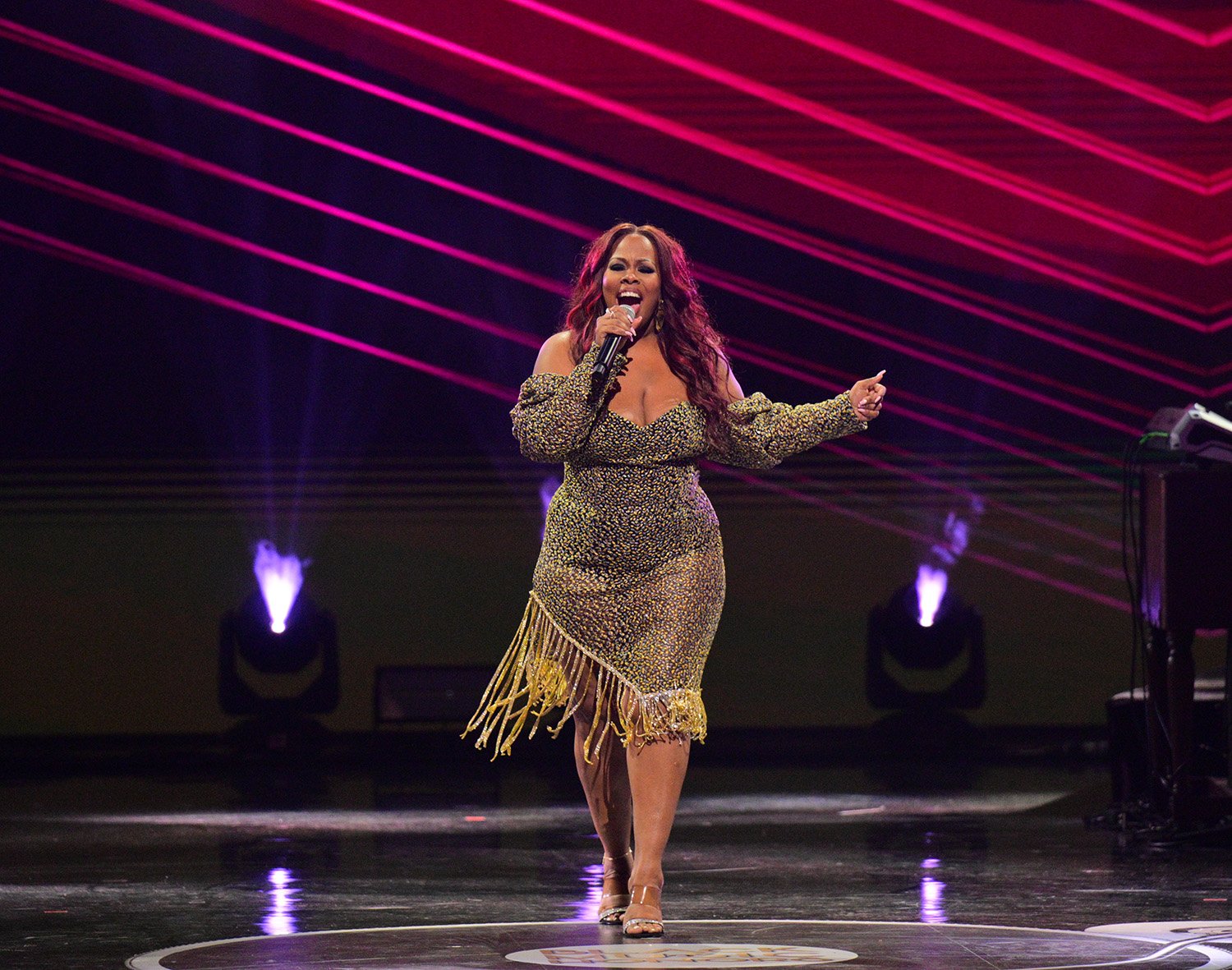 Amber Riley, who many fans think is Harp on The Masked Singer, performs at the 7th Annual Black Music Honors