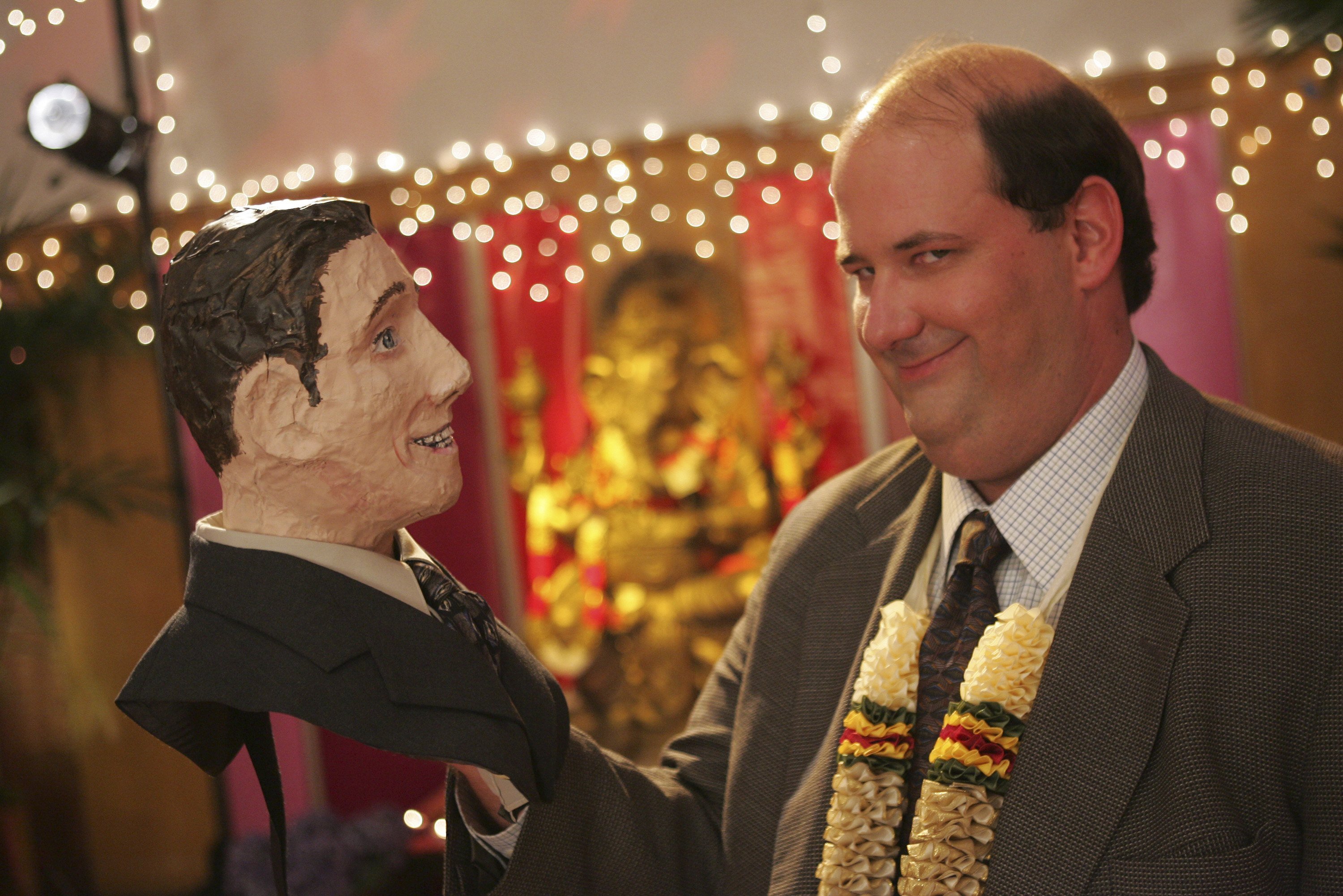 Kevin Malone (Brian Baumgartner) holds part of Michael's Halloween costume in the 'Diwali' episode of 'The Office'