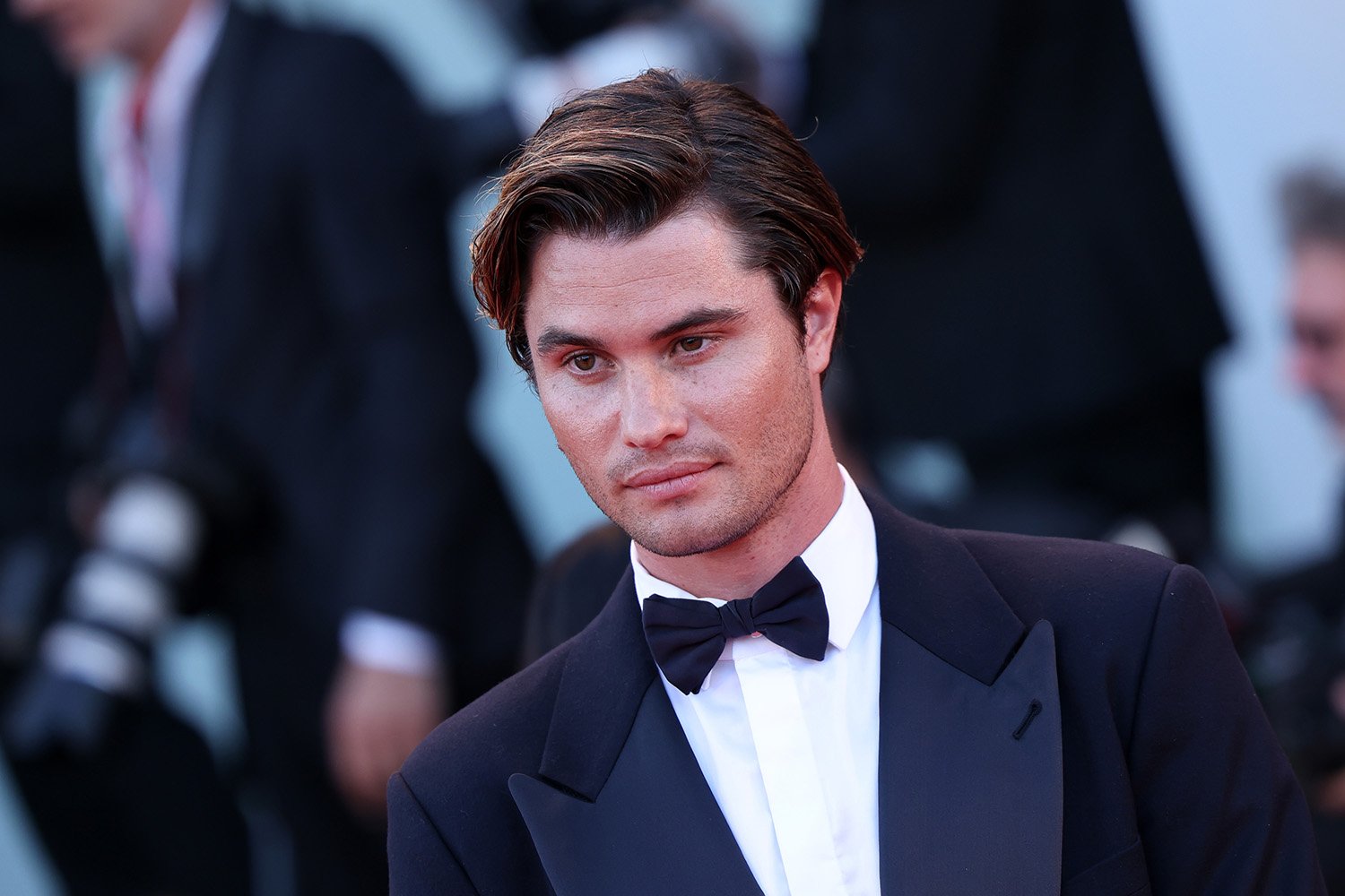 Outer Banks star Chase Stokes, who was once cast in One of Us Is Lying, poses in a tuxedo at the 79th Venice International Film Festival