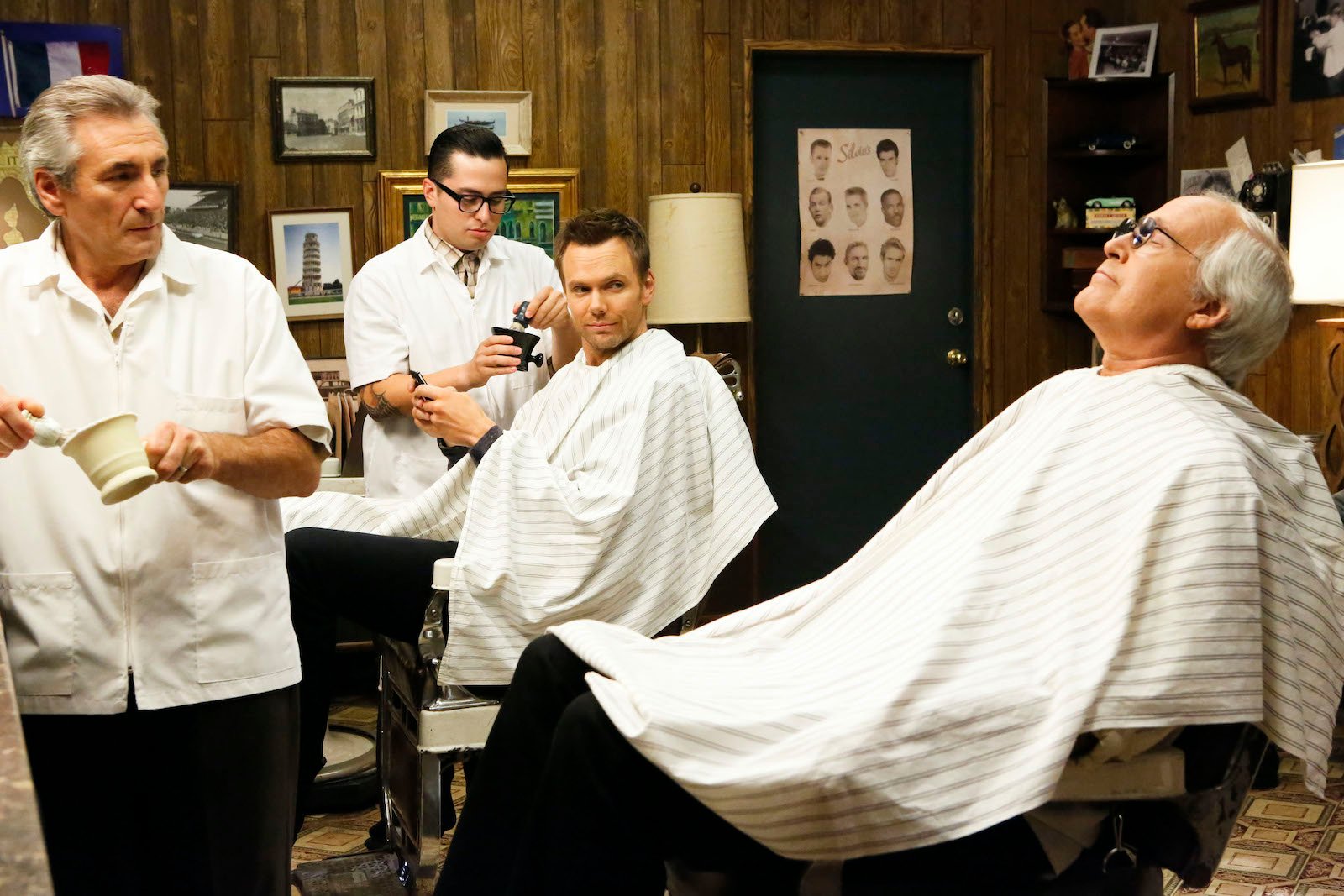 Joel McHale as Jeff Winger, Chevy Chase as Pierce in 'Community' sit in barber shop chairs 
