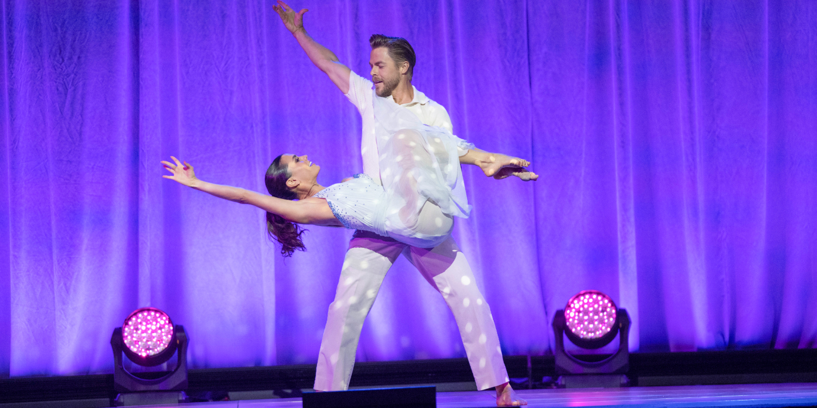 Hayley Erbert and Derek Hough perform at the D23 expo in 2022.