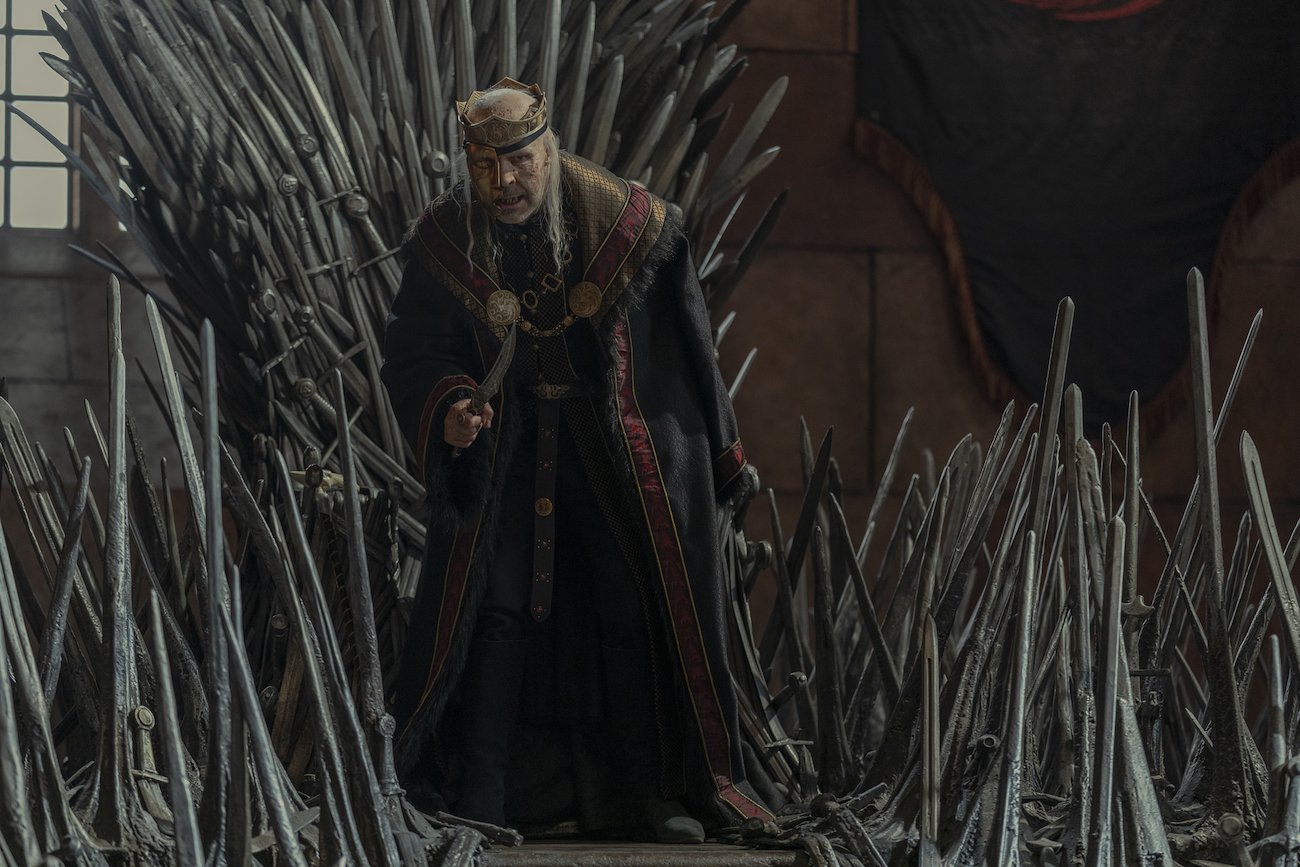 King Viserys (Paddy Considine) hovers over the Iron Throne in 'House of the Dragon' Episode 8