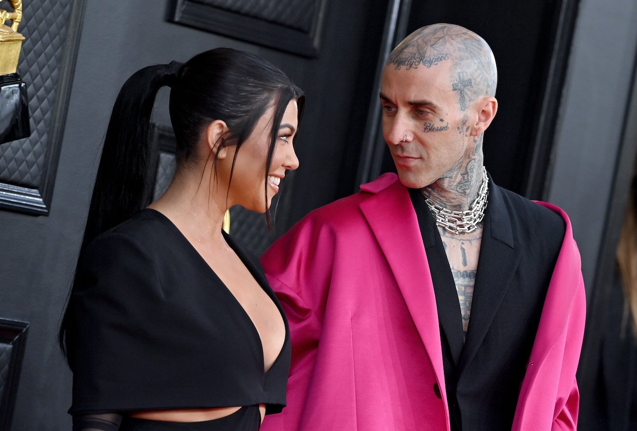Kourtney Kardashian and Travis Barker at the 2022 Grammy Awards just hours before they got married in their impromptu Las Vegas wedding