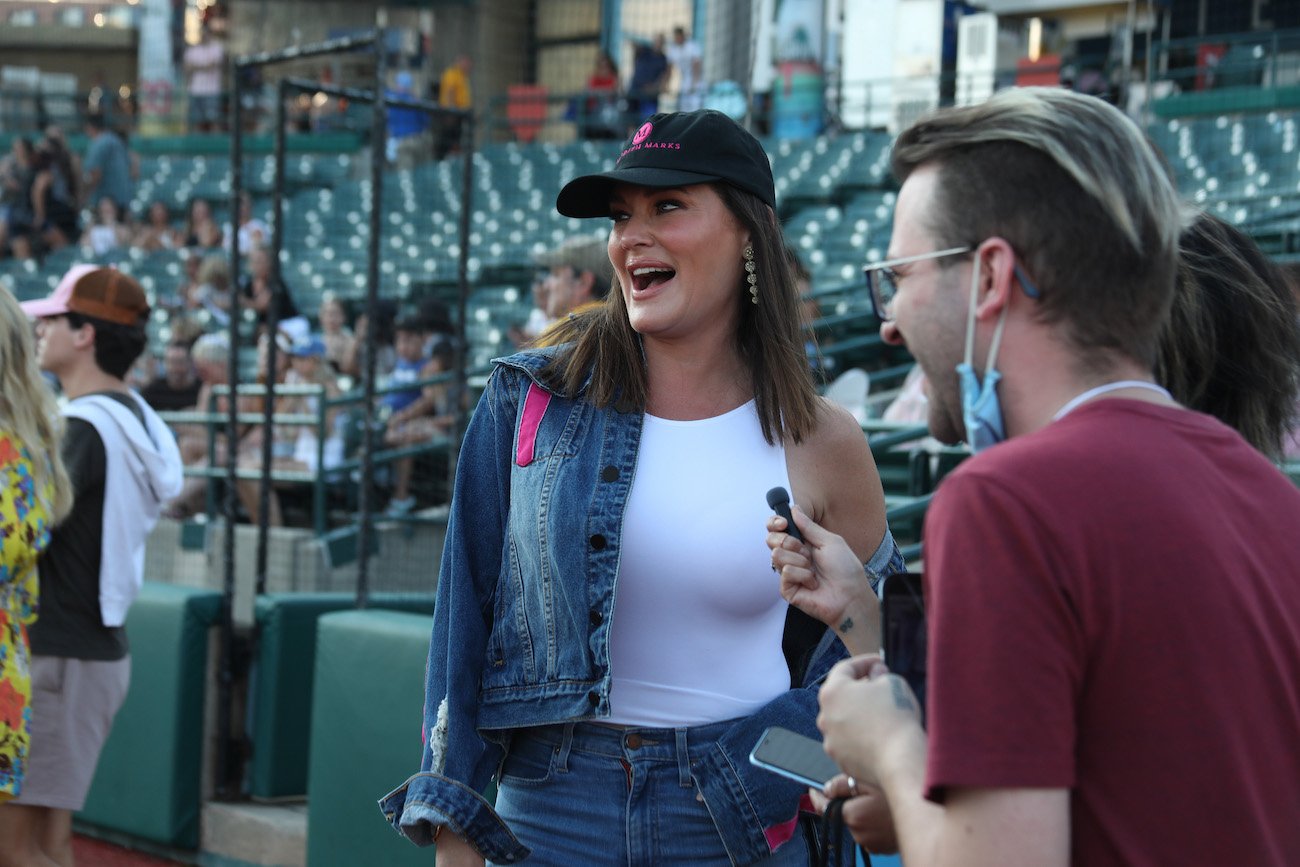 'RHOSLC' star Meredith Marks wearing a branded hat from her boutique at a charity softball game in 2021