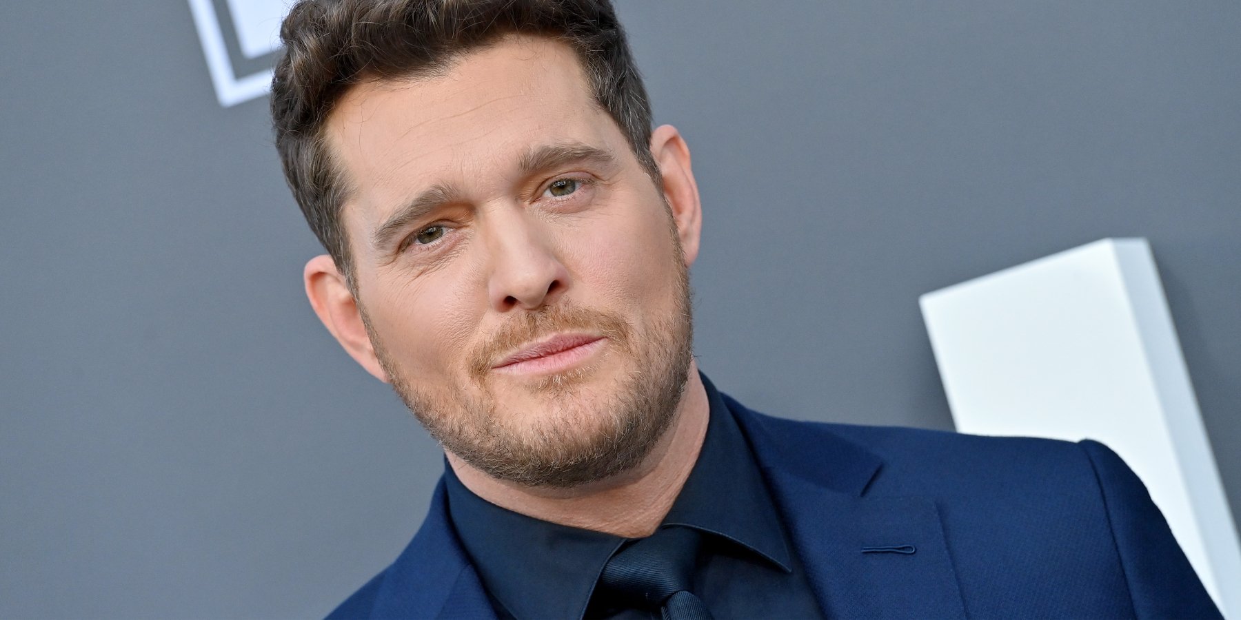 Michael Buble poses on the red carpet in 2022, he will be featured in a themed night for 'Dancing with the Stars.'