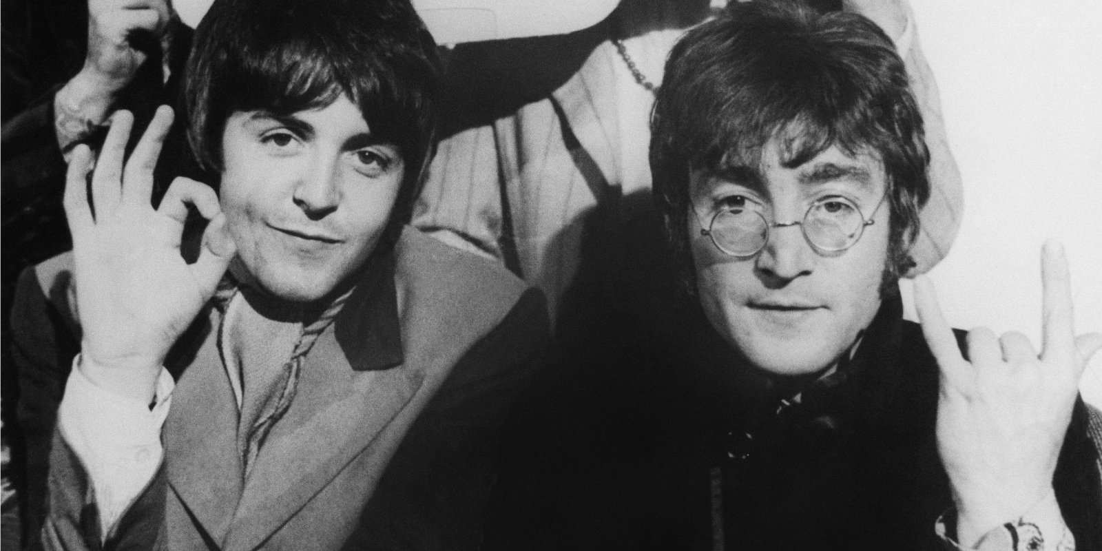 Paul McCartney and John Lennon pose together in a photograph taken in the mid-1960s.