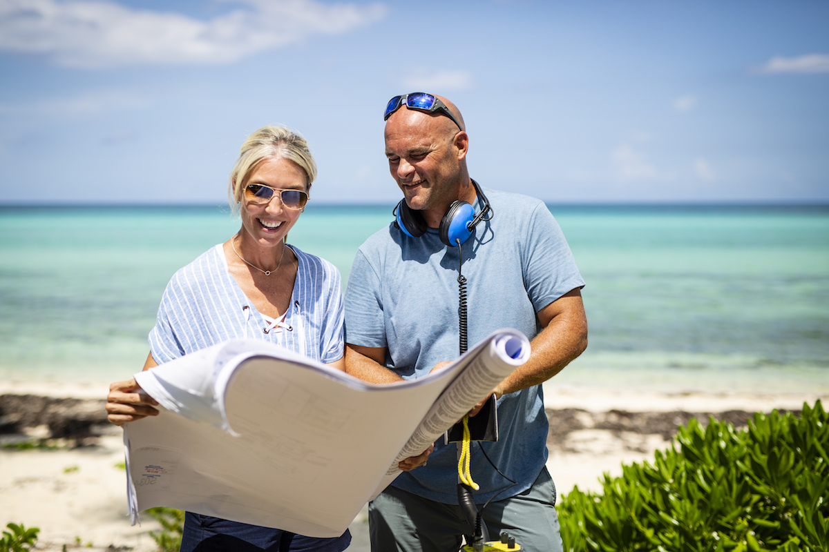 Sarah and Bryan Baeumler looking at plans on HGTV's 'Renovation Island'