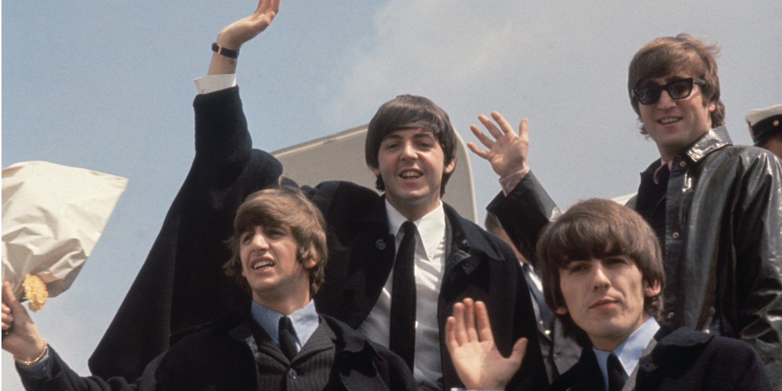 The Beatles (from left to right, John Lennon (1940 - 1980), George Harrison (1943 - 2001), Paul McCartney and Ringo Starr) arrive back at London Airport after their Australian tour.