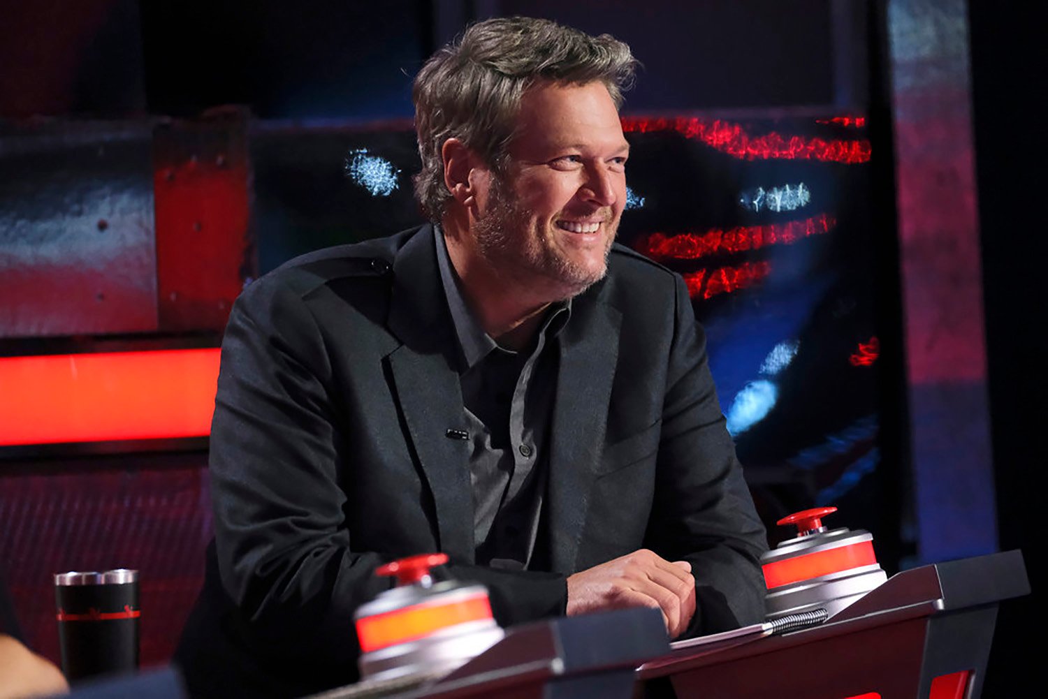 Blake Shelton smiles in his chair on The Voice Season 22