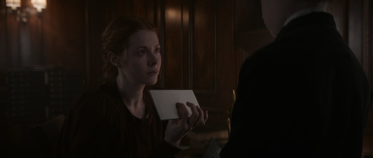 Emily Beecham, as Maura Franklin, holds an envelope up to someone in a production still for '1899.' What is '1899' on Netflix about?