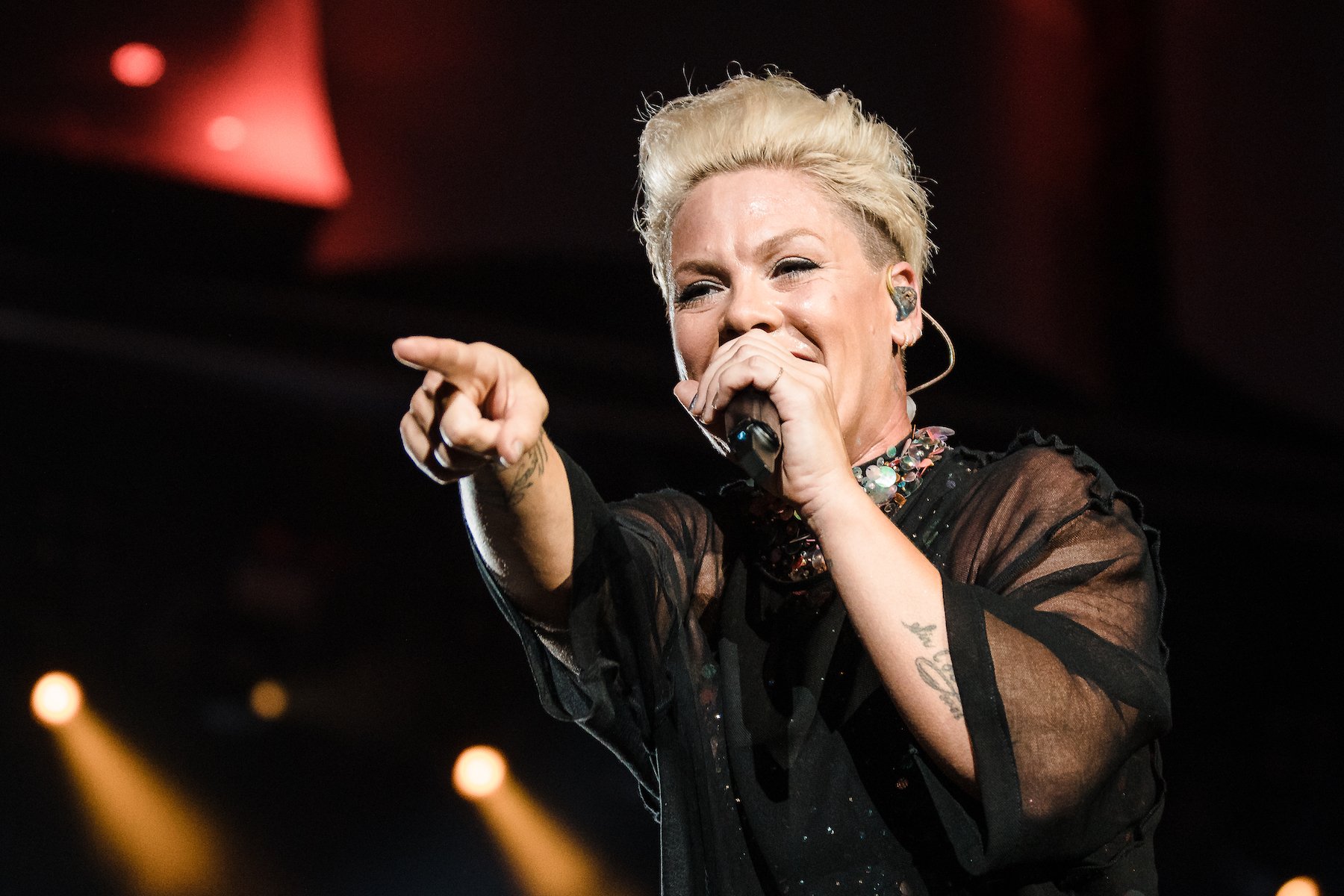 P!nk, one of the performers at the 2022 AMAs, wearing black and singing into a mic