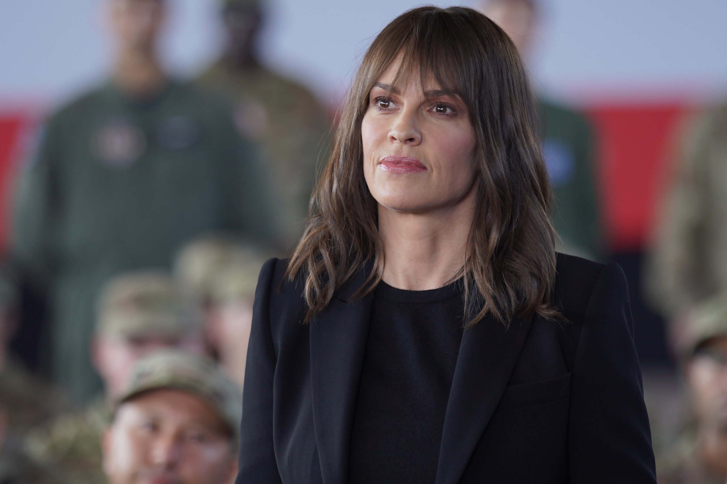 Hilary Swank, in character as Eileen Fitzgerald in 'Alaska Daily' Episode 5, wears a black suit over a black shirt.