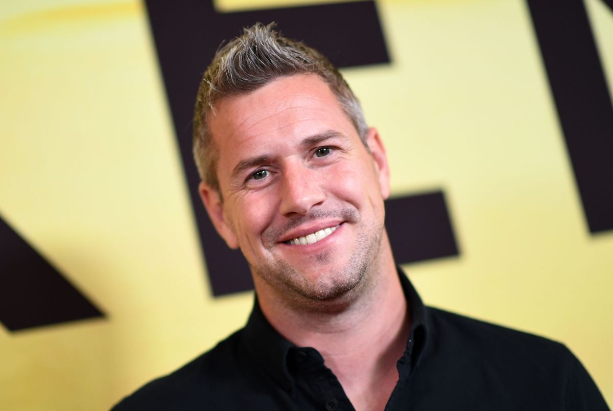 Ant Anstead, who is dating actor Renée Zellweger, smiles and poses at an event.