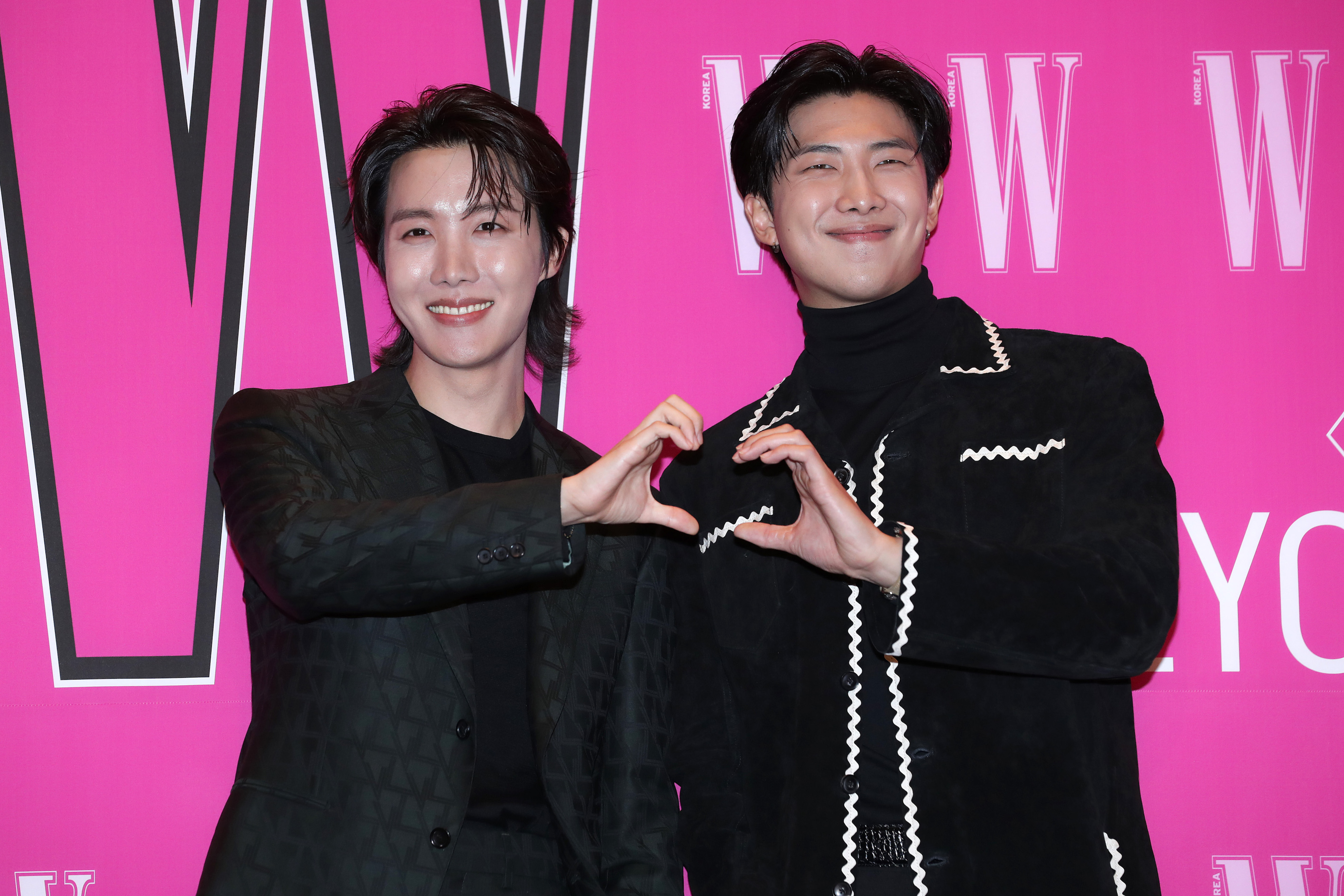 J-Hope and RM of boy band BTS pose for photographs at the W Magazine Korea Breast Cancer Awareness Campaign