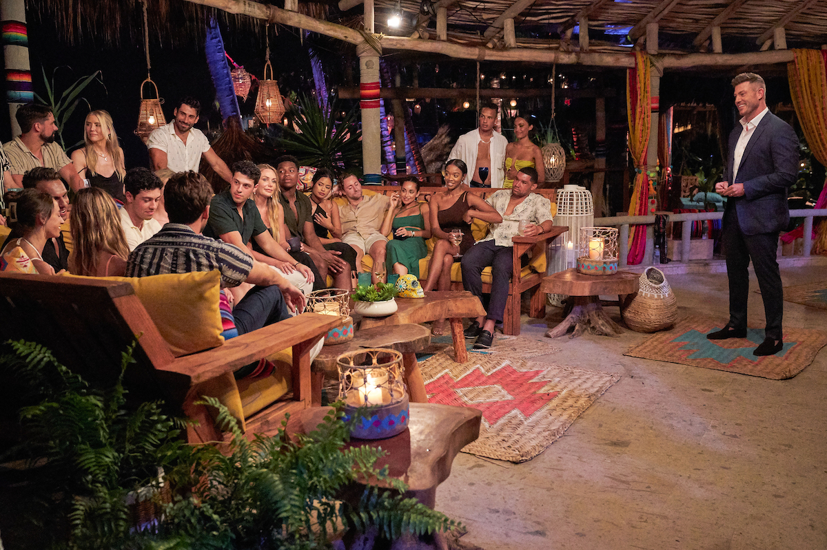 The 'Bachelor in Paradise' Season 8 cast sitting together with Jesse Palmer standing in front of them. They are headed to the reunion