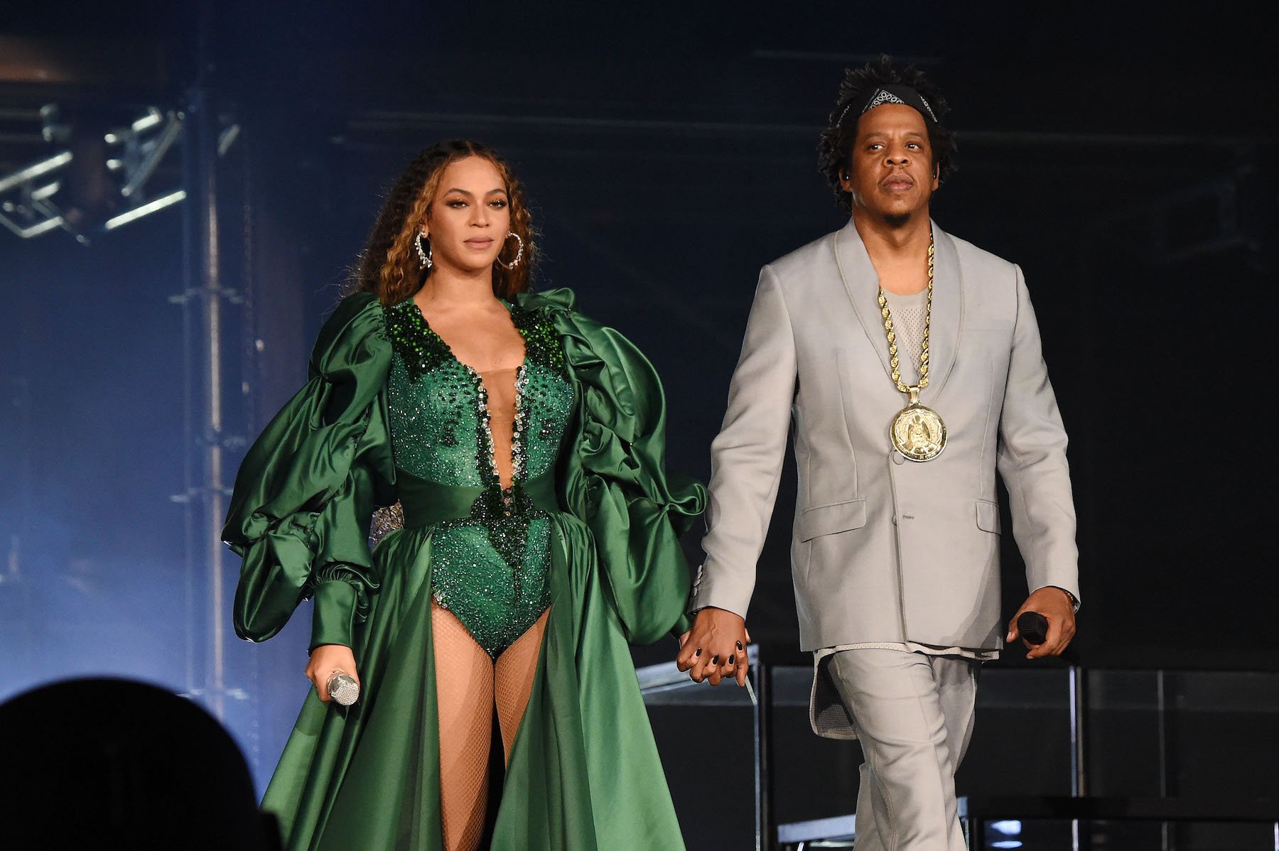 Grammy winners Beyoncé & Jay-Z holding hands on stage