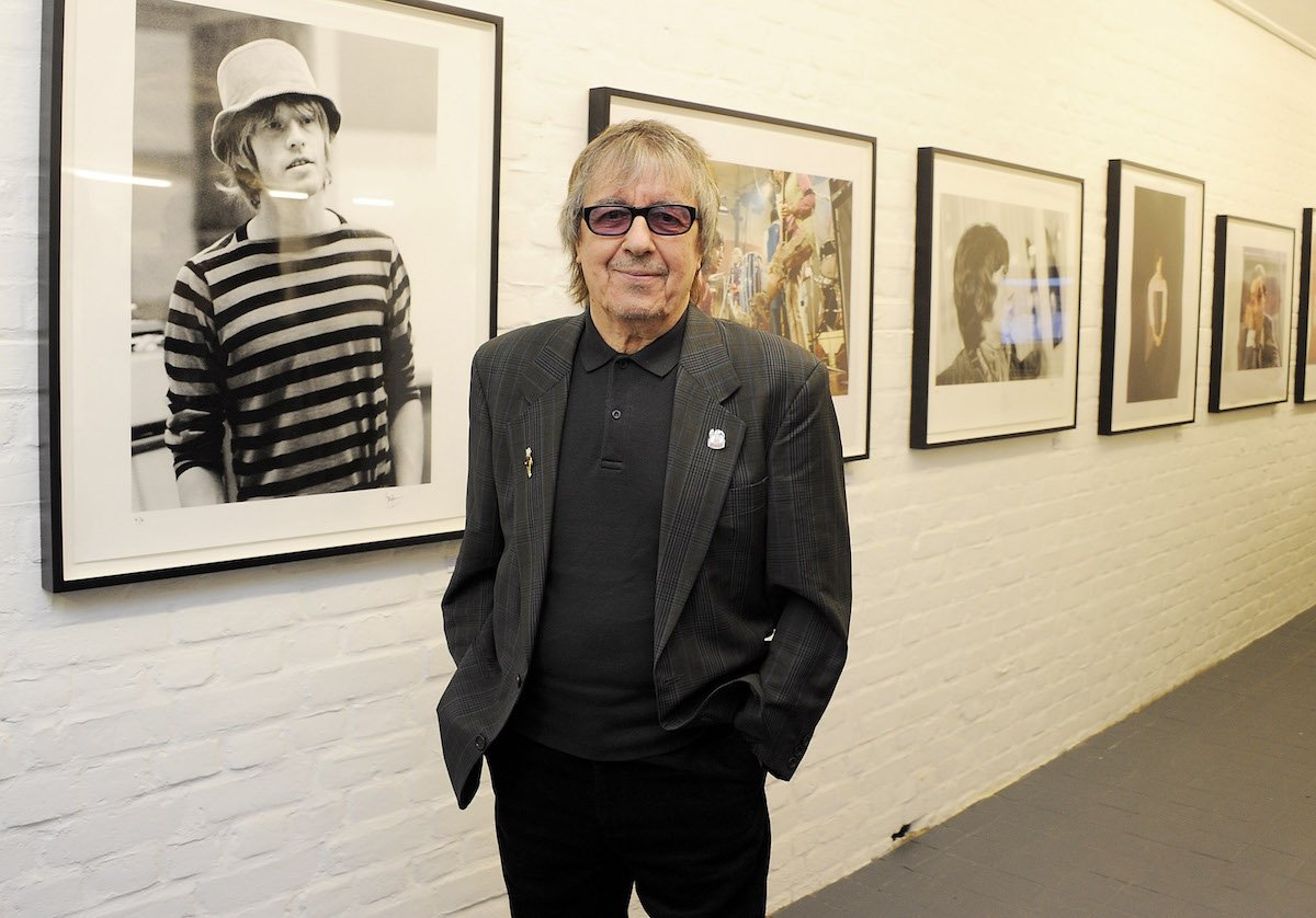 Bill Wyman stands by an exhibition of his photographs in 2011