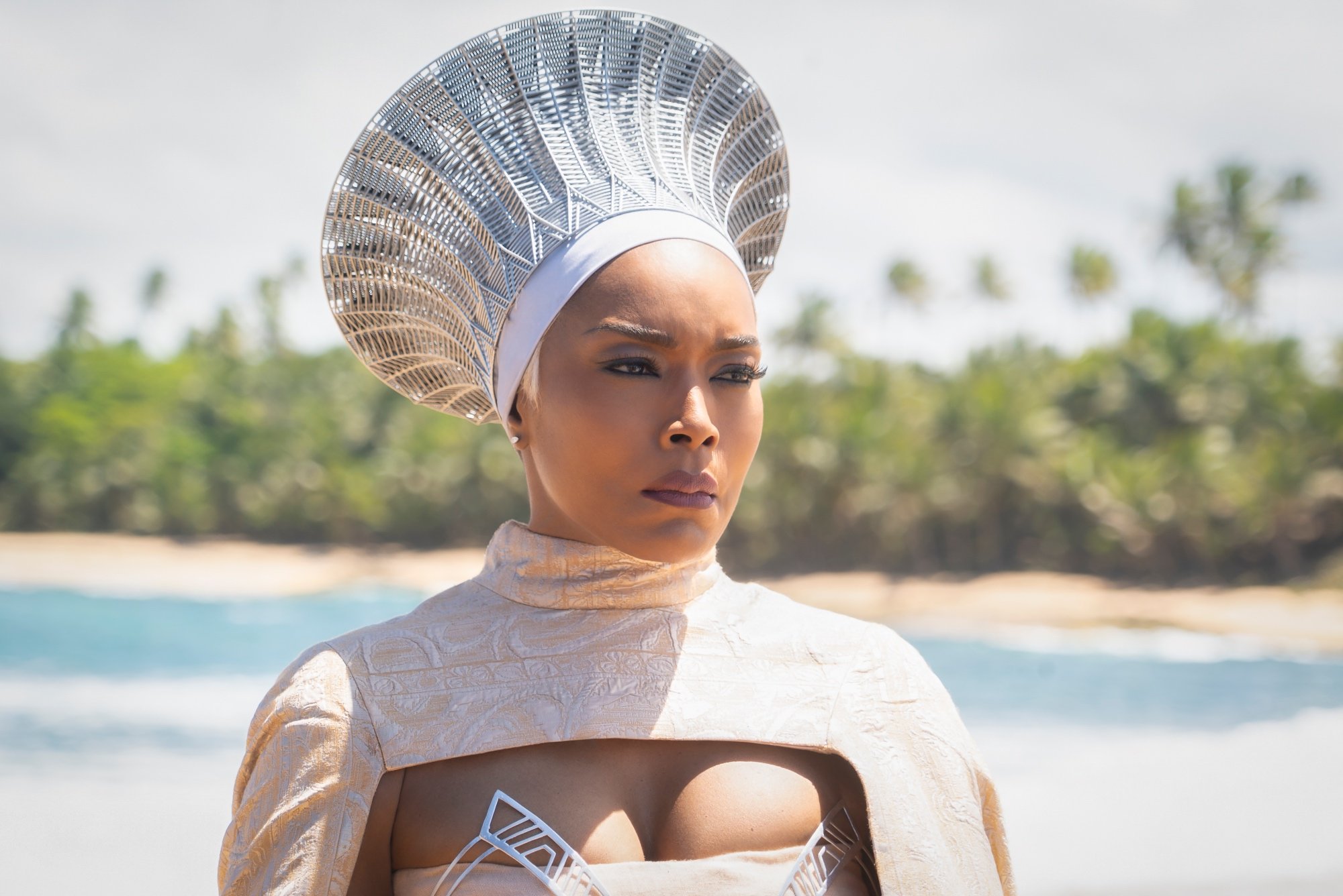 'Black Panther: Wakanda Forever' Angela Bassett as Ramonda wearing all-white and a headpiece in front of the ocean