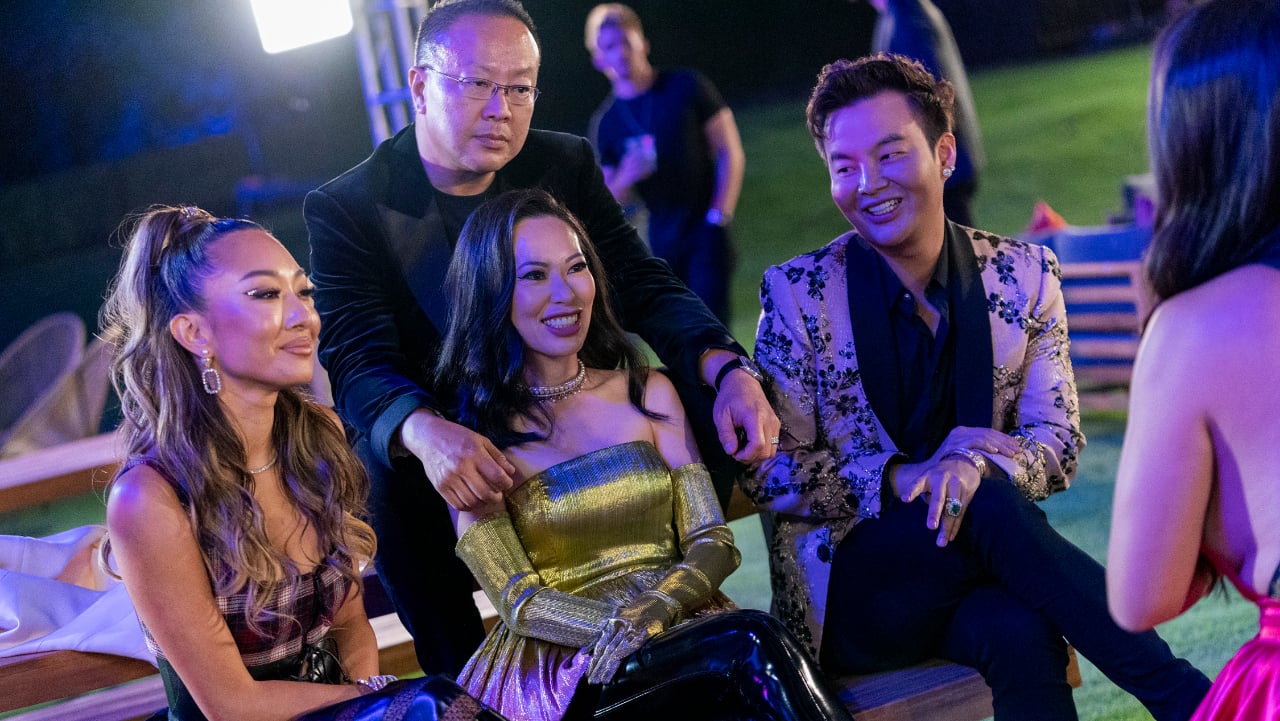 Dr. Gabriel Chiu, Christine Chiu, and Kane Lim sitting next to each other during an episode of 'Bling Empire'