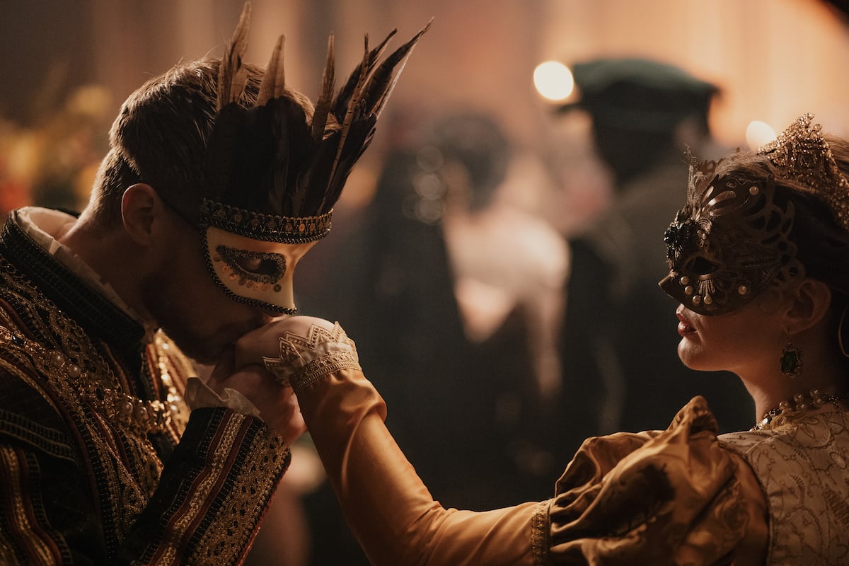 'Blood, Sex & Royalty' production still showing two actors in masquerade masks and period costume