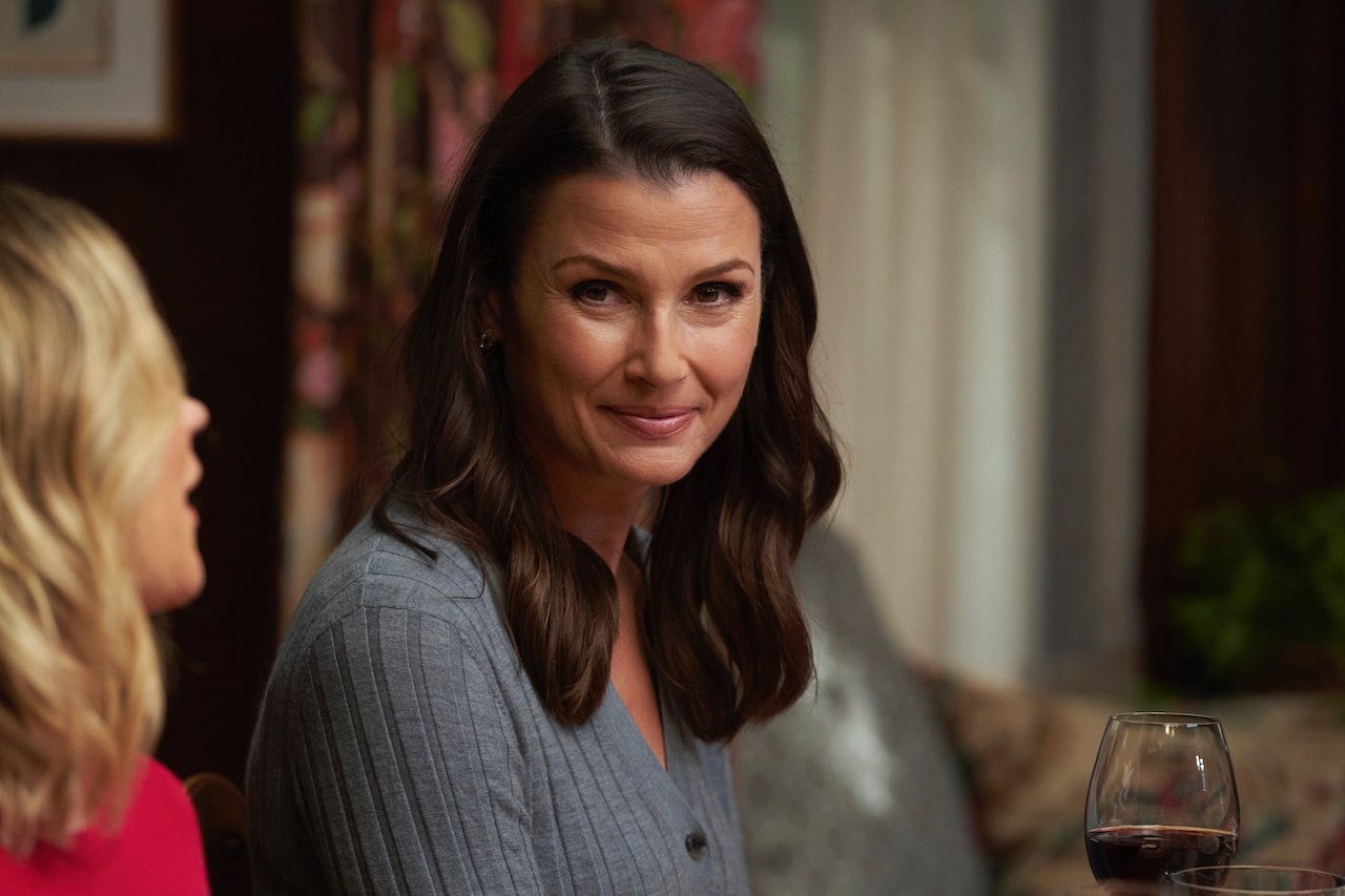 Erin Reagan (Bridget Moynahan) smiles at the family table on 'Blue Bloods'.