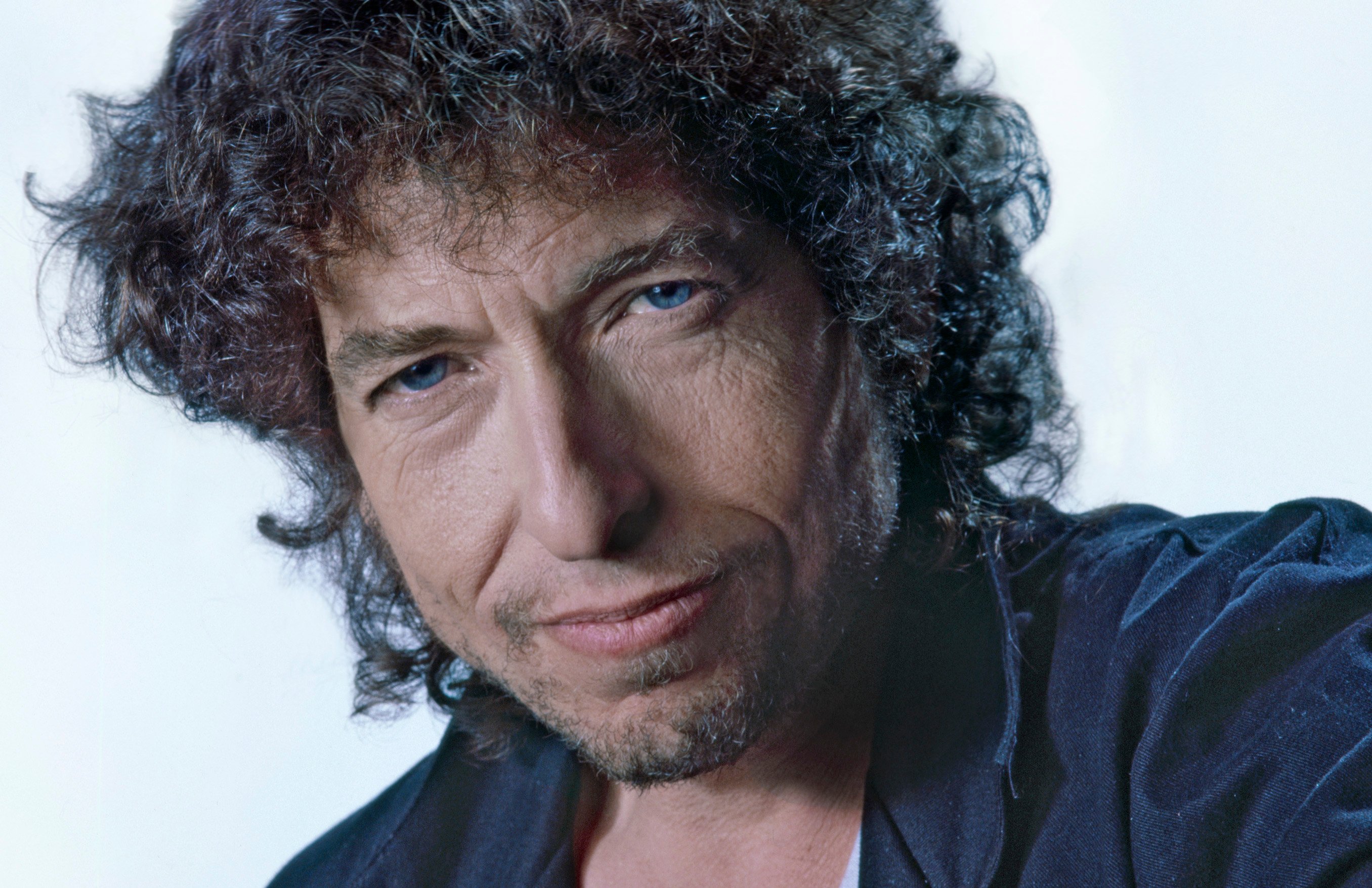 Bob Dylan wears a blue shirt.