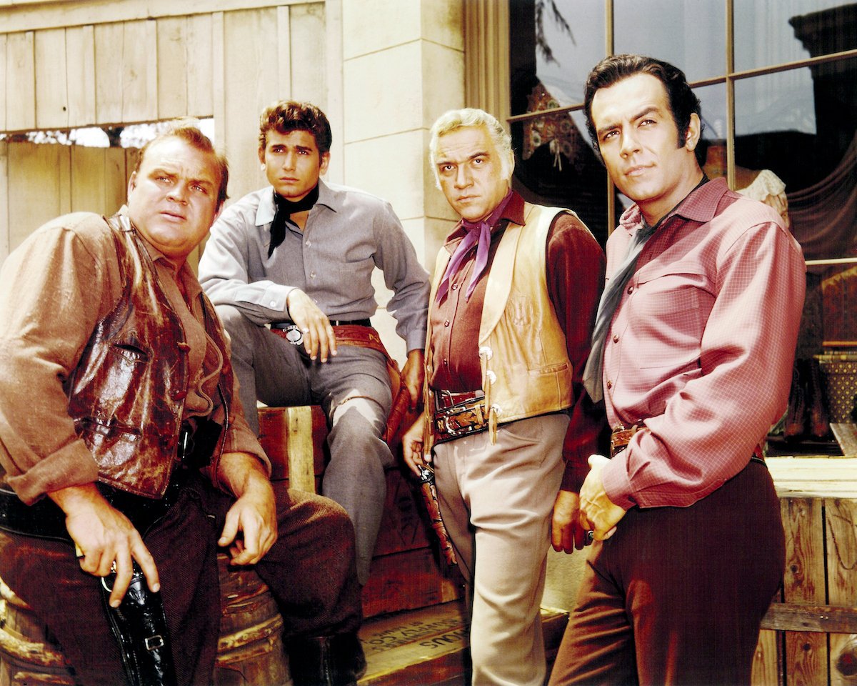 Dan Blocker, Michael Landon, Lorne Greene, and Pernell Roberts standing together in 'Bonanza'