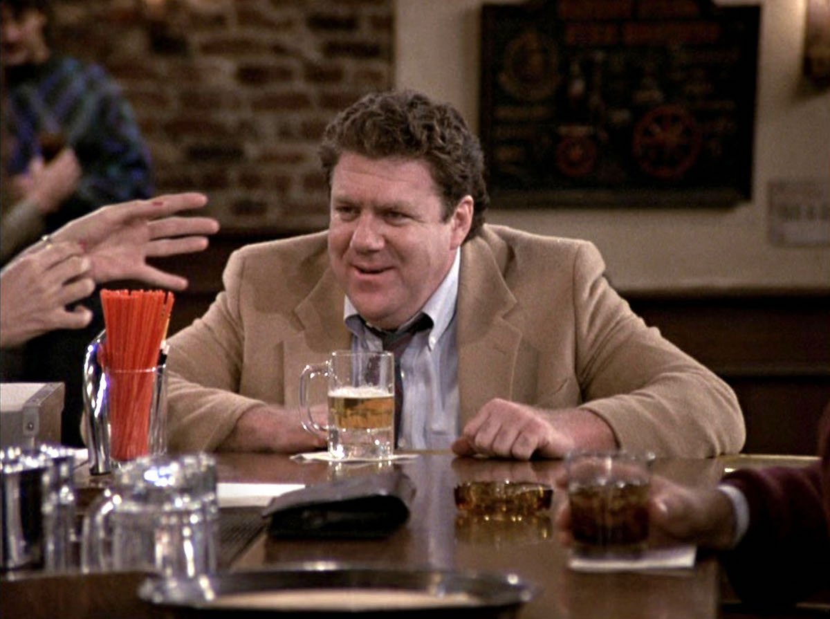 'Cheers': Norm (George Wendt) sits at the bar with a beer