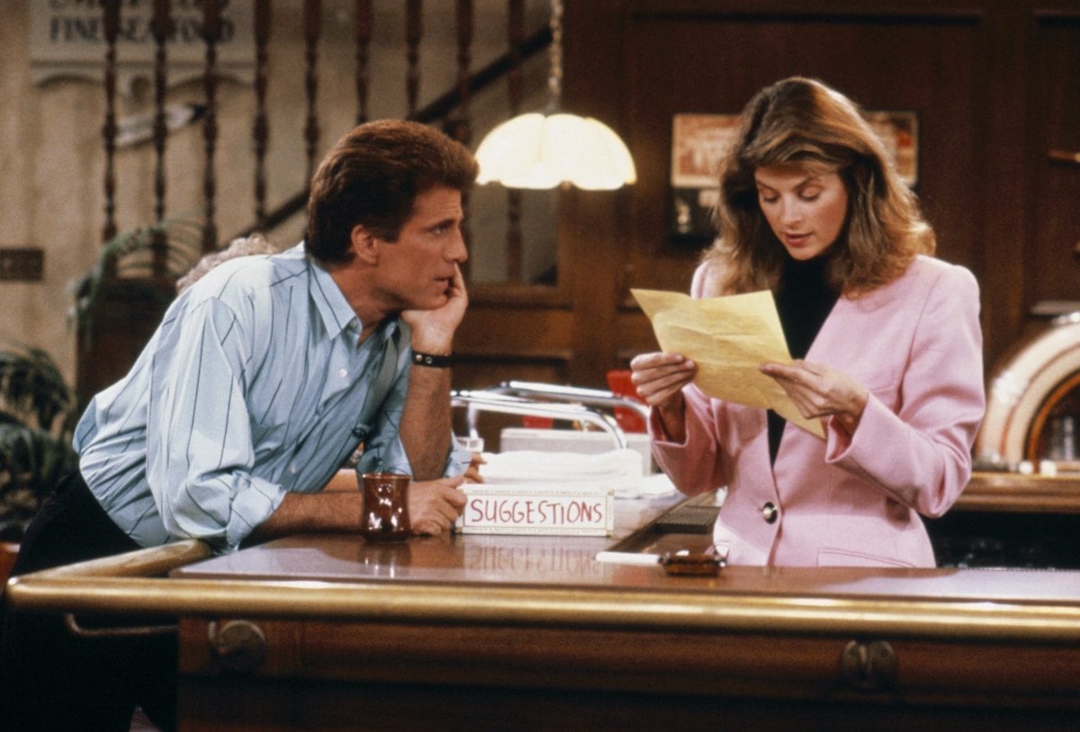 'Cheers' Season 6: Sam (Ted Danson) leans on the bar while Rebecca (Kirstie Alley) reads a paper