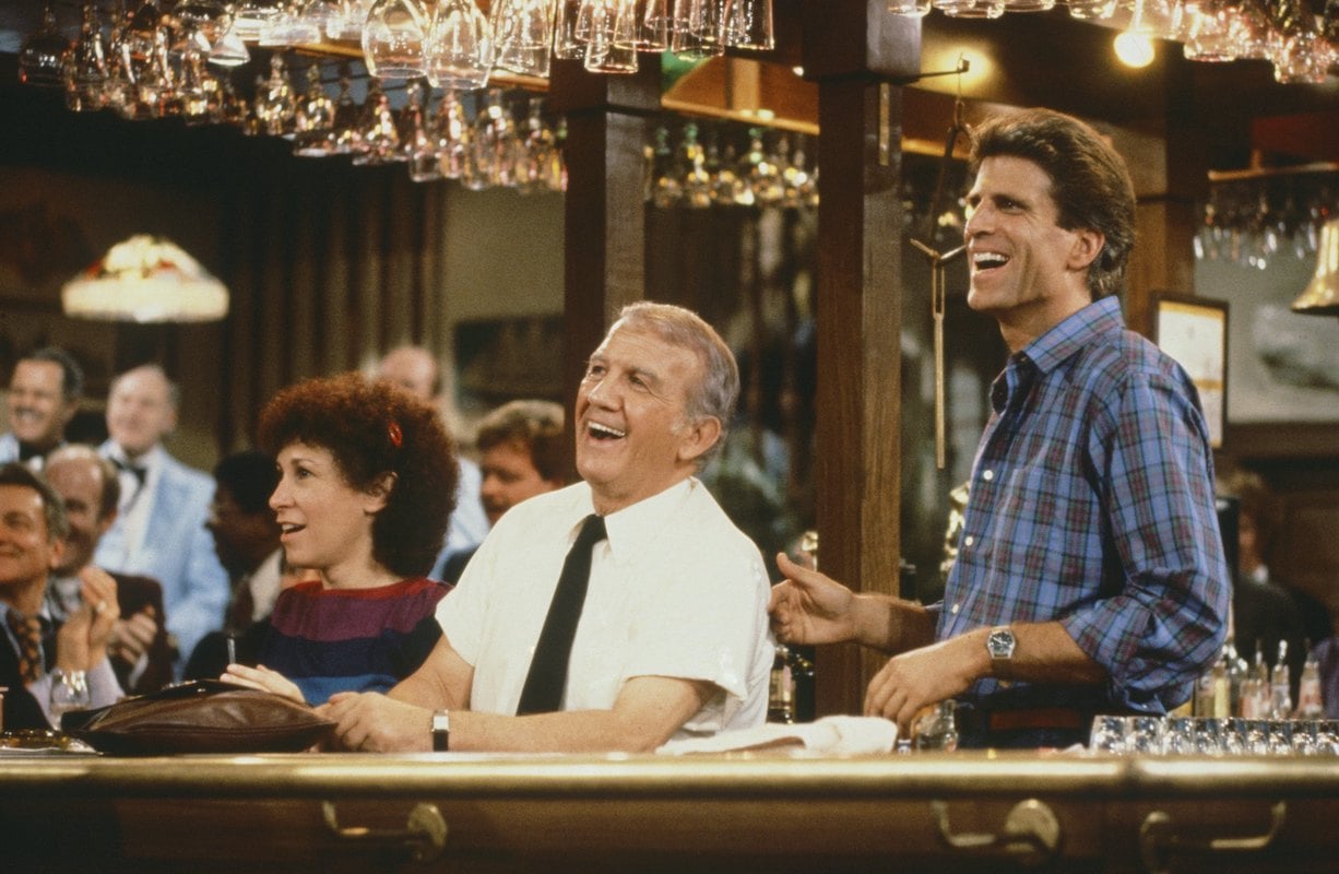 'Cheers': Carla, Coach and Sam laugh behind the bar