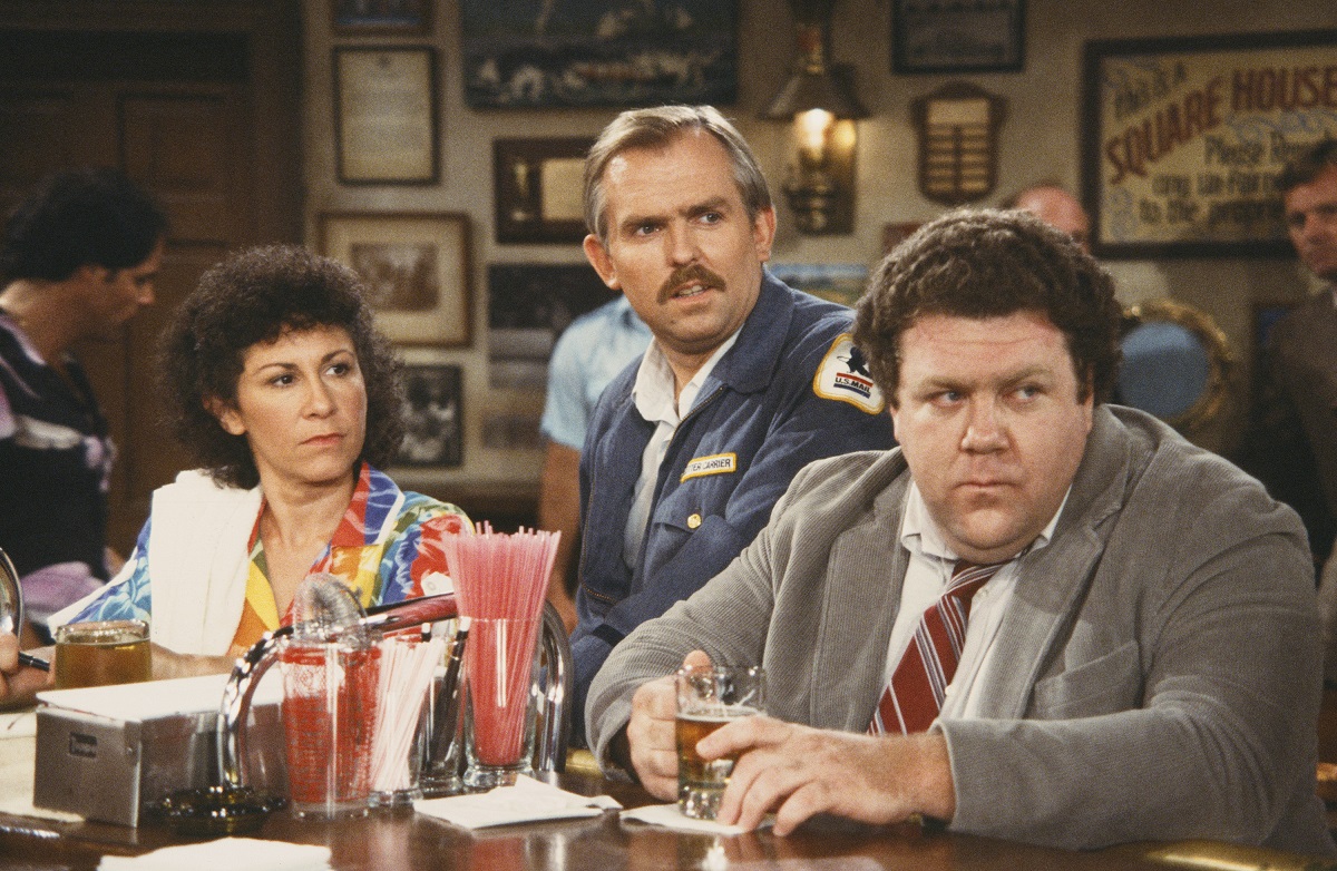 Rhea Perlman as Carla Tortelli, John Ratzenberger as Cliff Clavin, and George Wendt as Norm Peterson in 'Cheers'