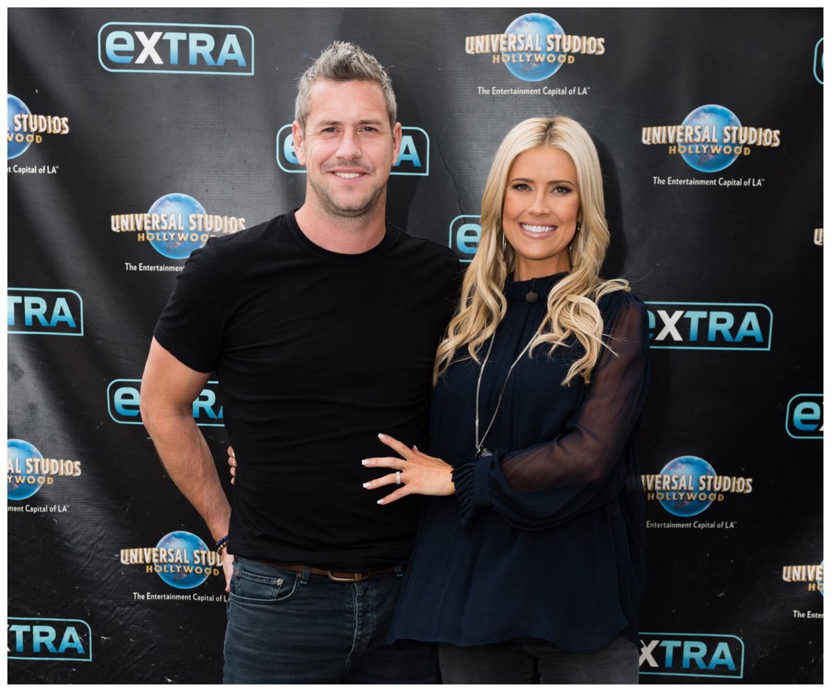 Ant Anstead and Christina Hall, who share son Hudson, pose together in matching black shirts at an event.