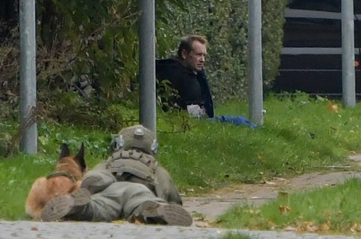 A police marksman and his dog observe convicted killer Peter Madsen as he attempts to break out of jail in 2020