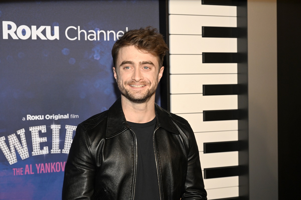 Daniel Radcliffe posing at the 'Weird Al' premiere.