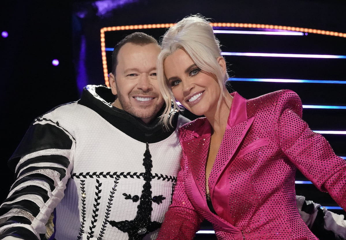 Married couple Donnie Wahlberg and Jenny McCarthy smile on The Masked Singer