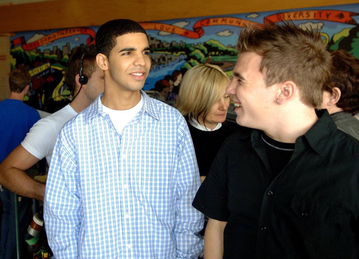Drake and Shane Kippel smile at the "Degrassi: The Next Generation" 100th Episode at Degrassi High School Set celebration