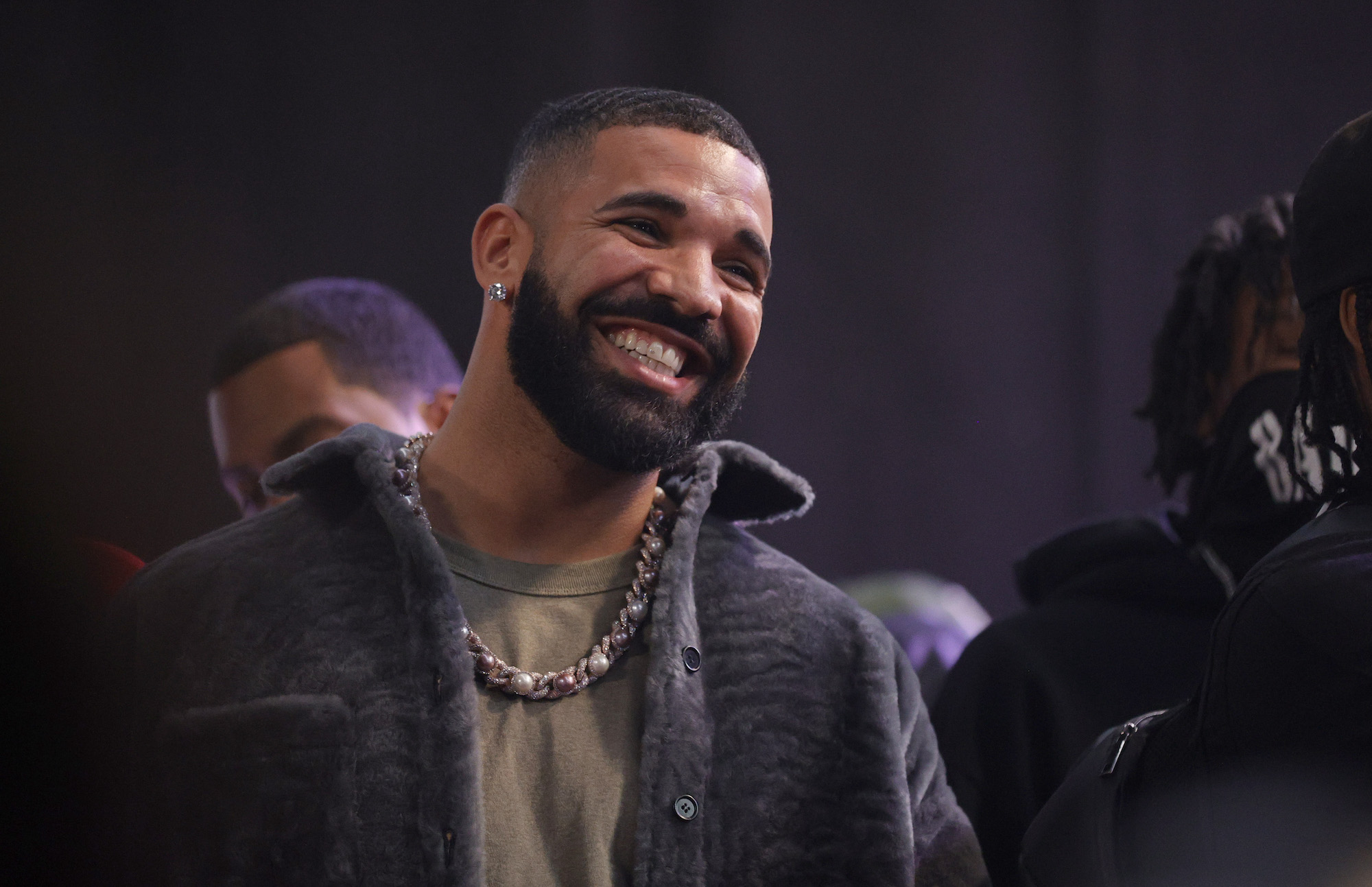 Drake, who rescheduled his Apollo Theater show, smiling for a photo