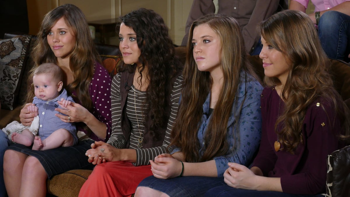 Jessa Duggar, Jinger Duggar, Joy-Anna Duggar, and Jana Duggar of the Duggar family sitting on a couch together