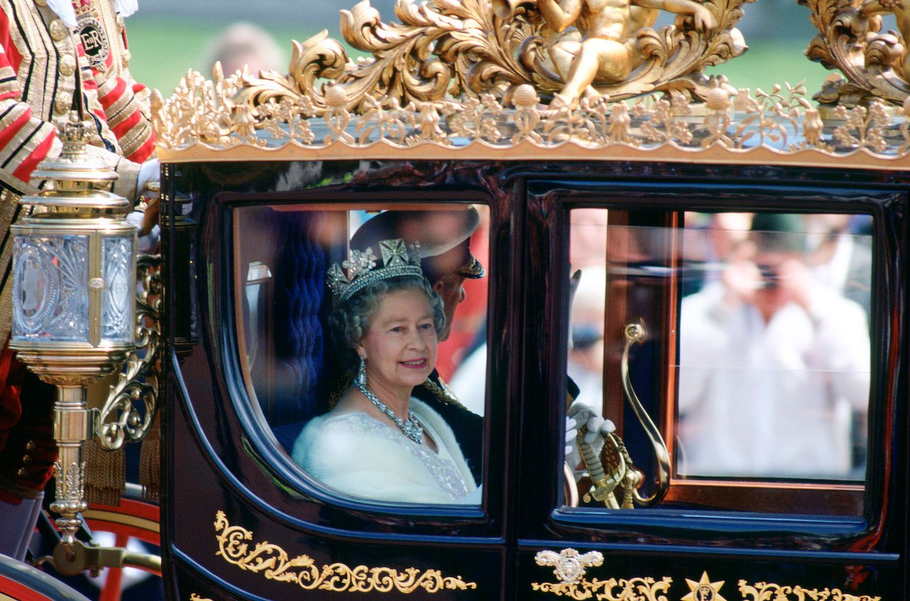 Queen Elizabeth II and Prince Philip in a state coach, a Bicentennial gift from Australia, in 1992. Some observers thought Elizabeth had 'Queen Victoria Syndrome' and should abdicate the throne around this time.