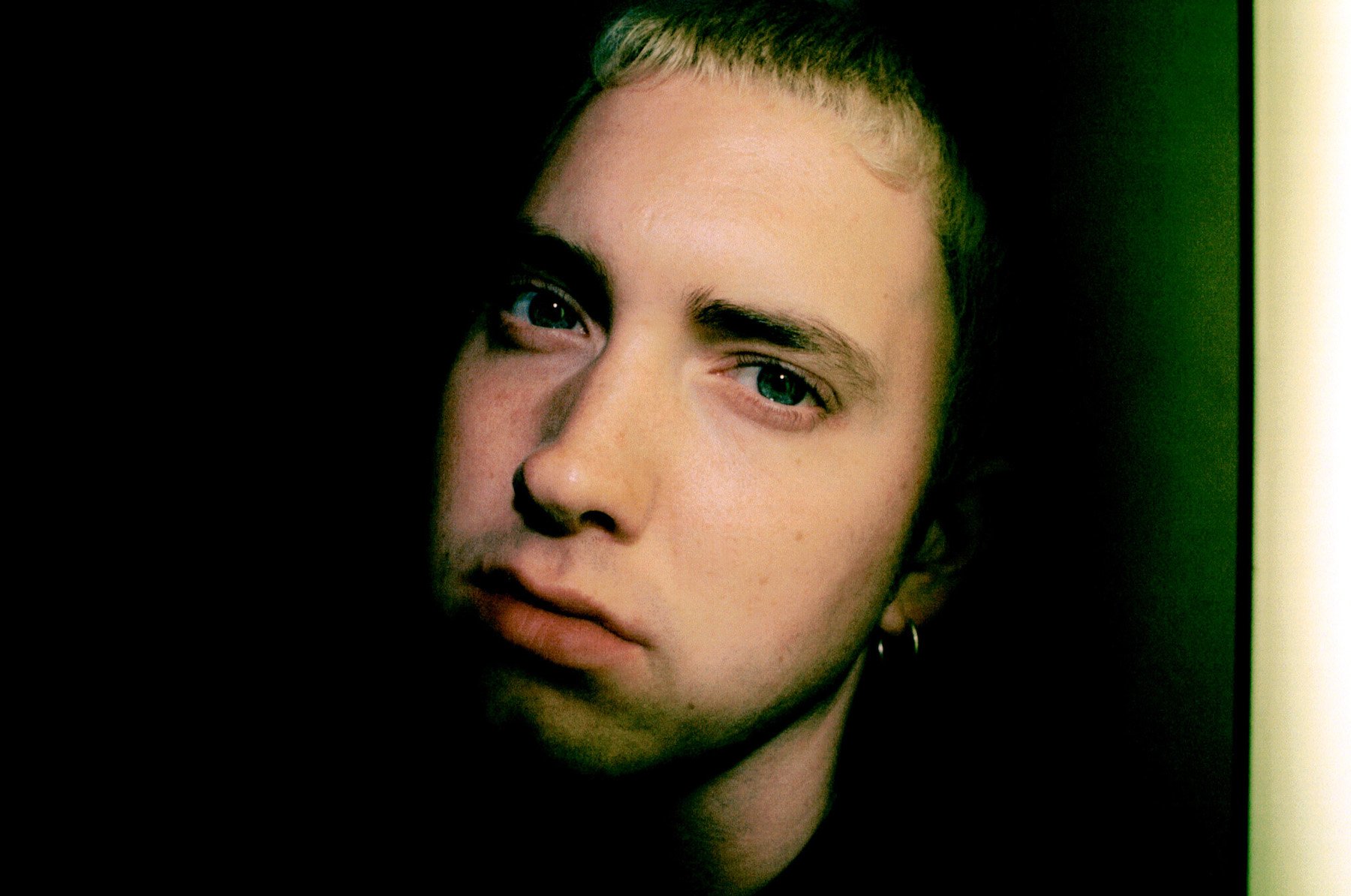 Eminem, who was sued by his mother for $10M, posing for a close-up photo