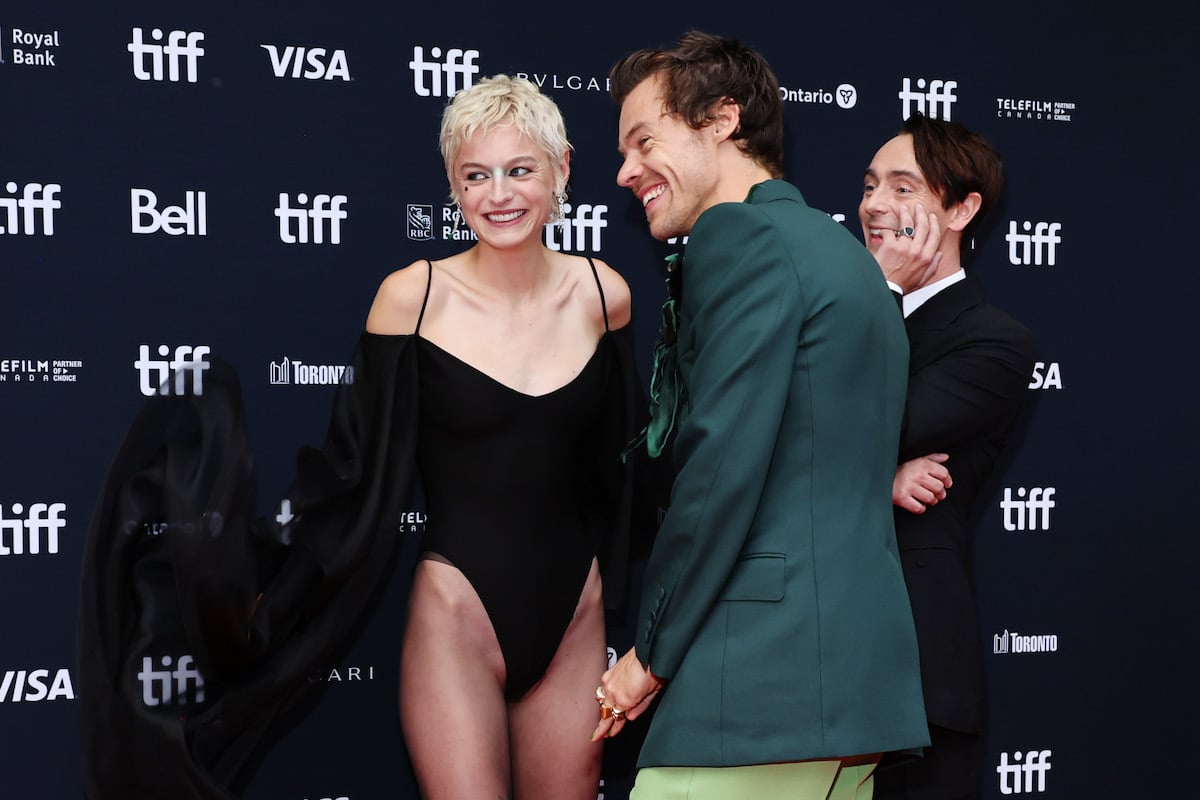 Emma Corrin and Harry Styles laugh at the "My Policeman" Premiere