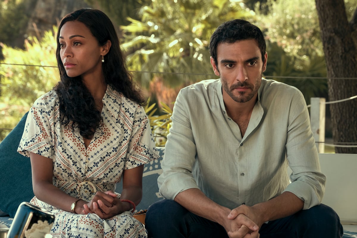 Zoe Saldana as Amy Wheeler and Eugenio Mastrandrea as Lino Ortolano sitting next to each other after an argument in 'From Scratch'